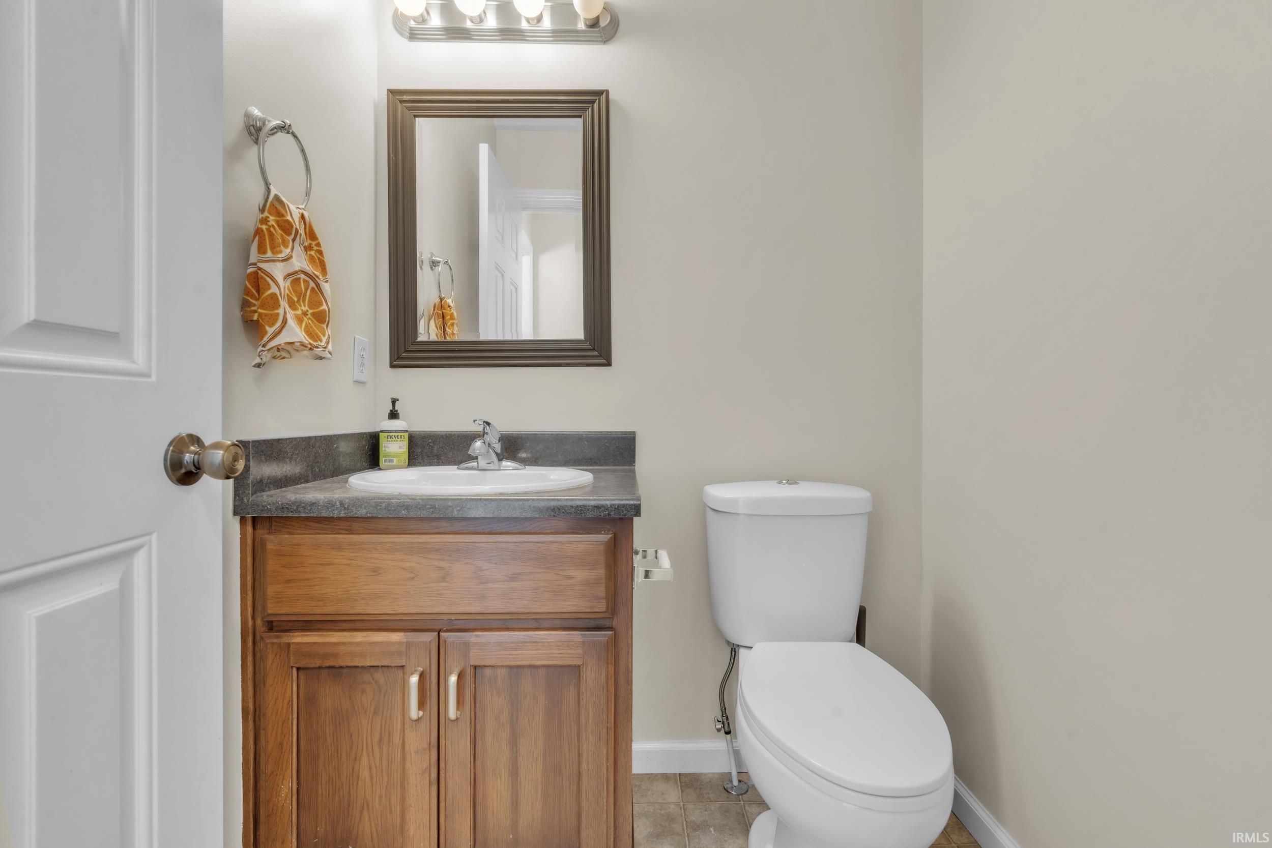 Bathroom featuring vanity and light tile patterned floors