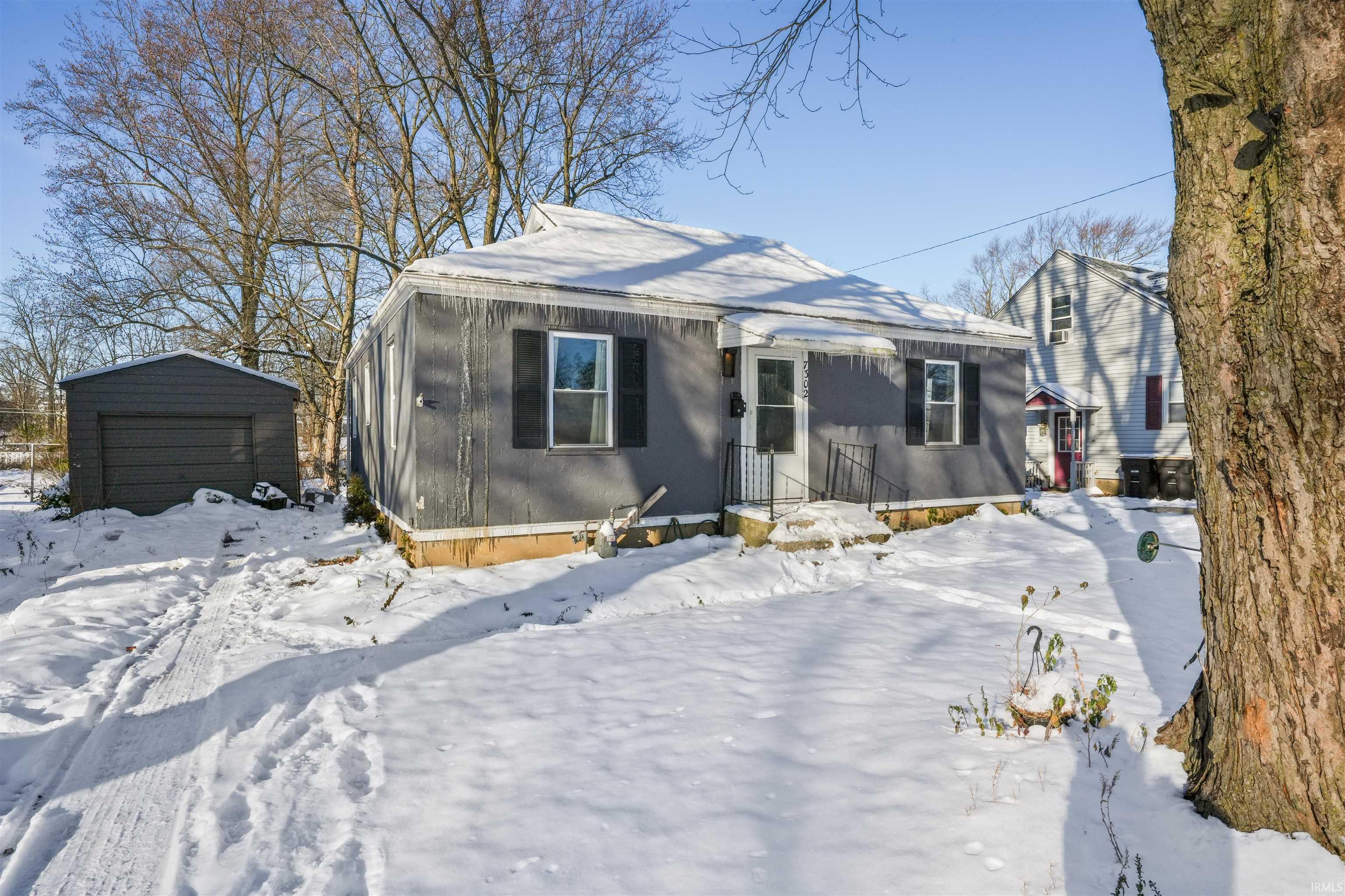 View of front of home with detached garage