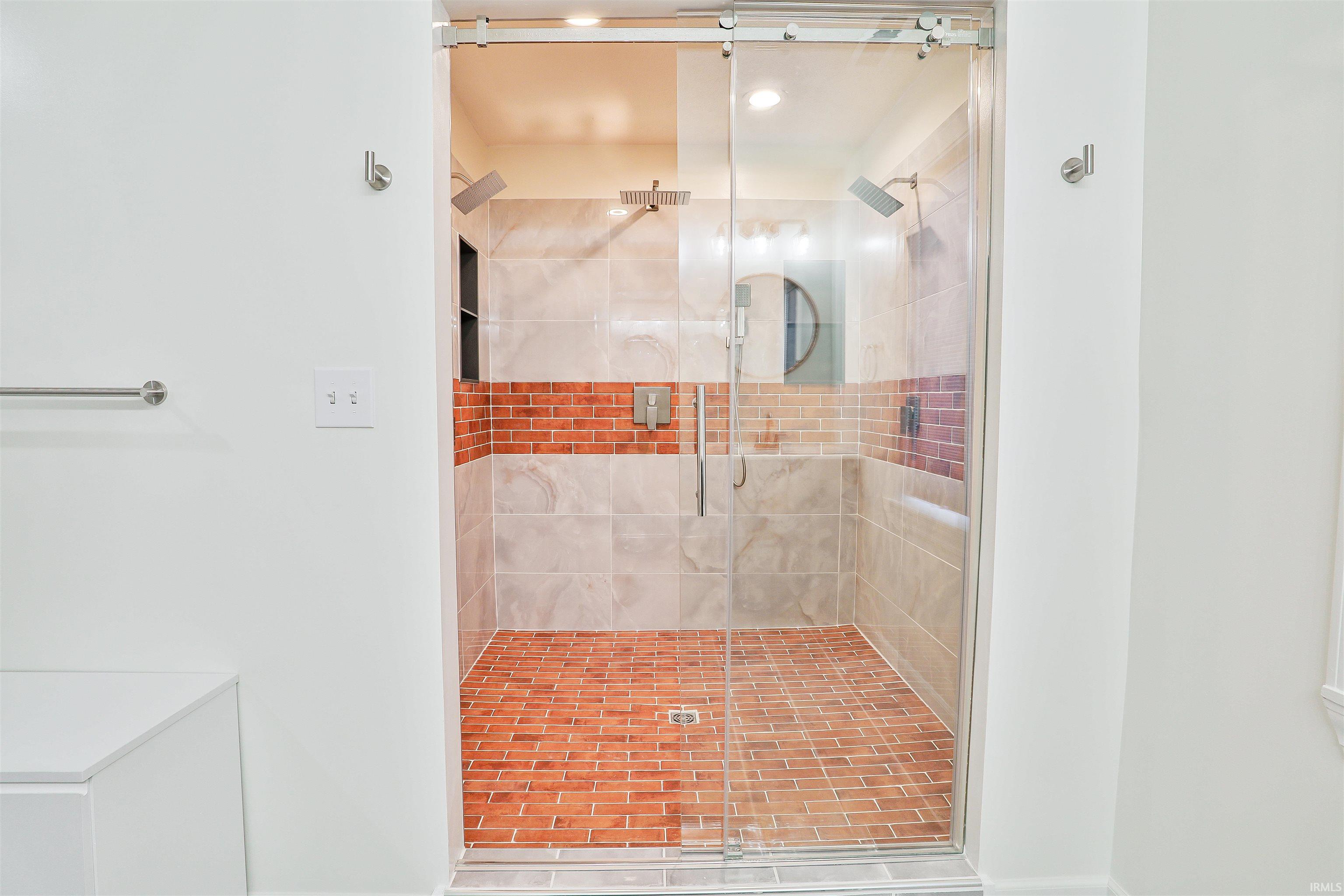 Full bath with a shower stall