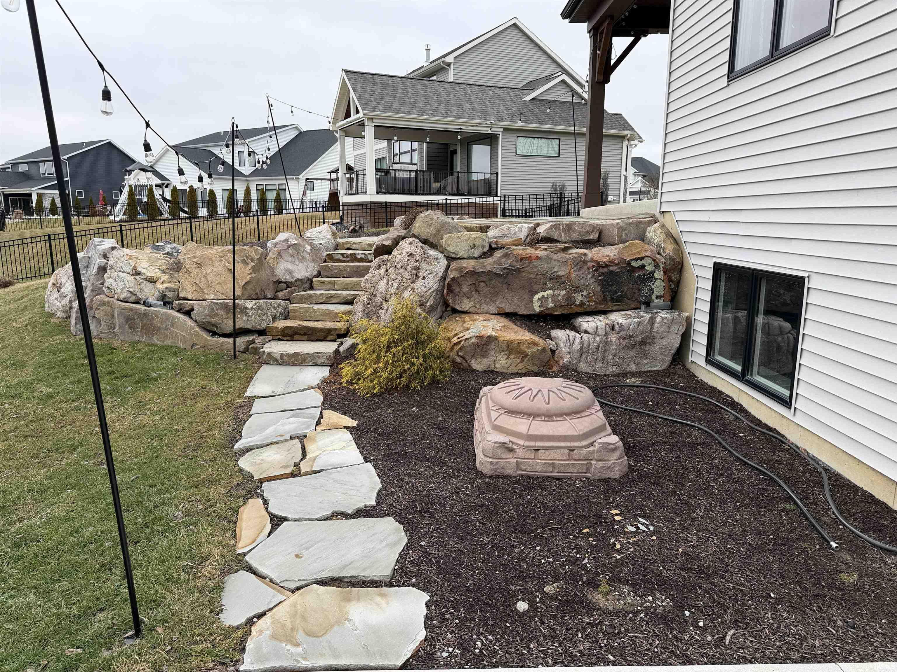View of yard and terraced landscape