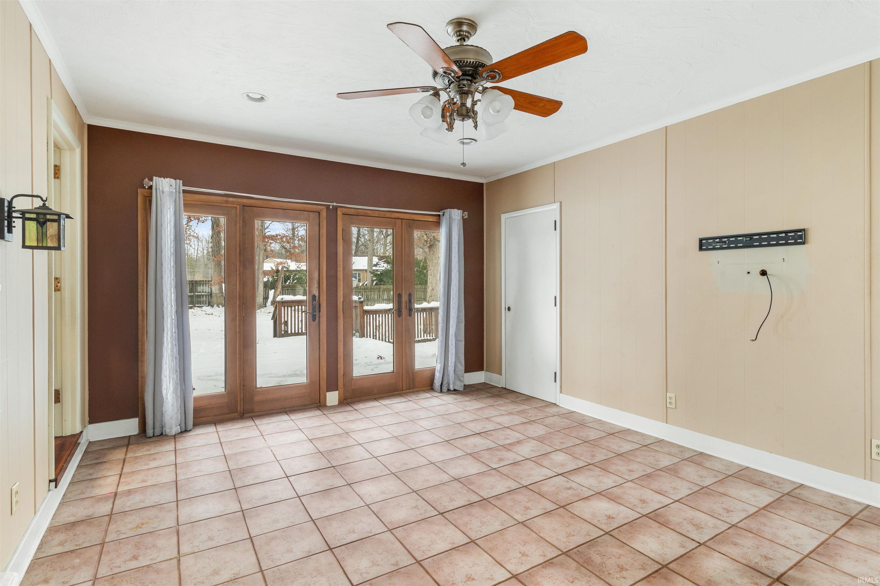 Spare room with ornamental molding, ceiling fan, tile patterned floors, french doors, and recessed lighting