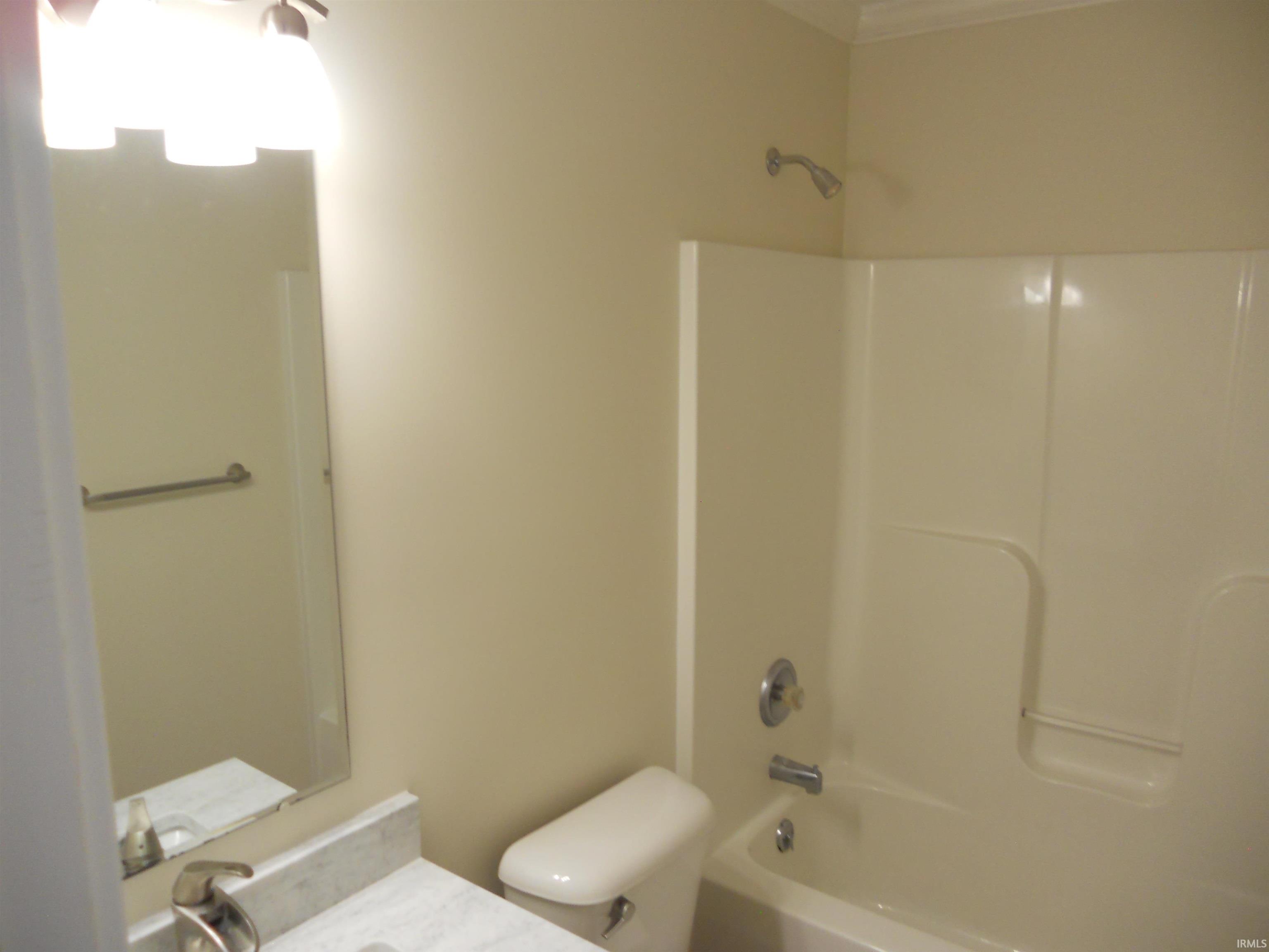 Full bath featuring vanity and shower / bathtub combination