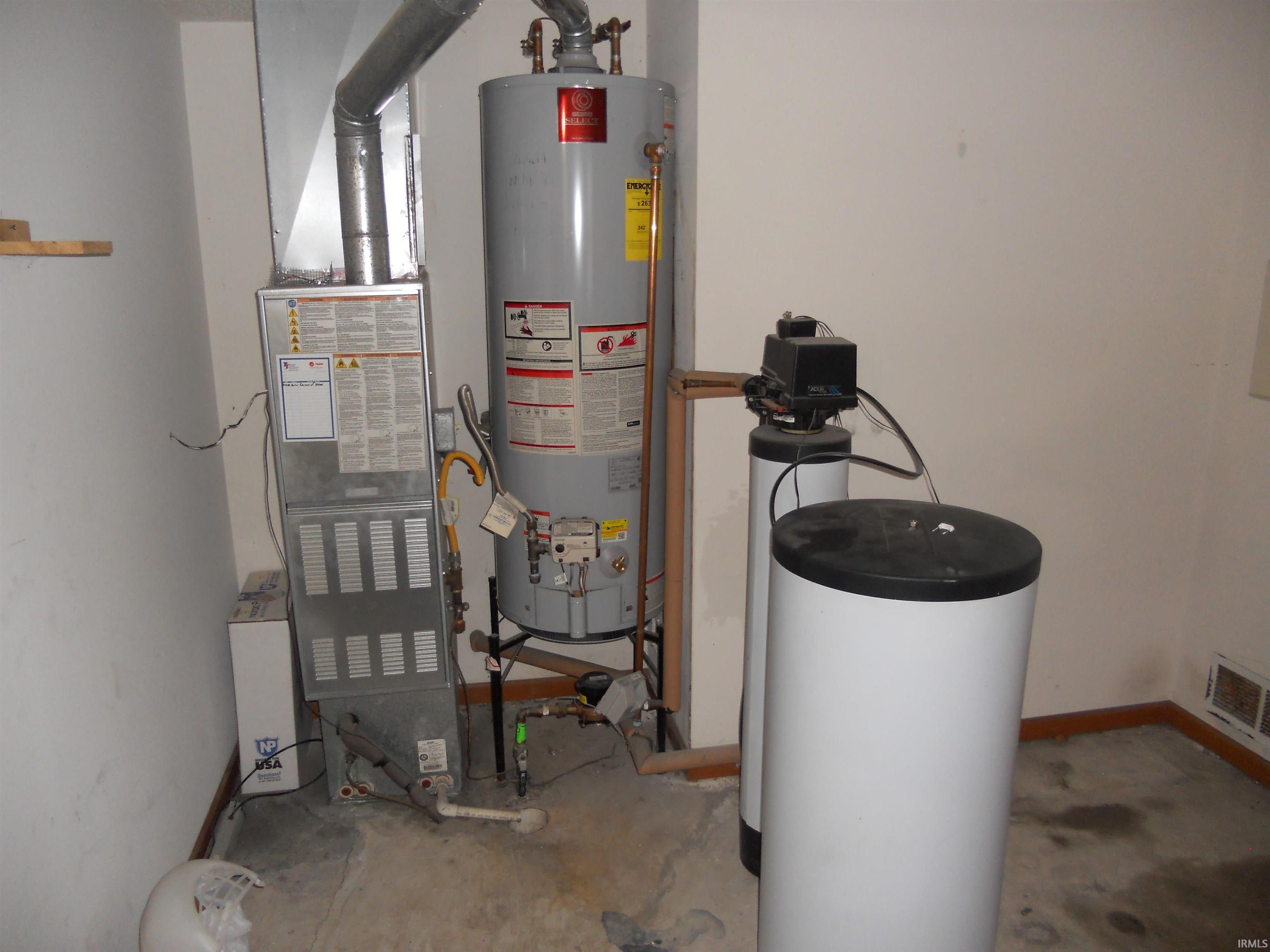 Utility room with water heater and heating unit