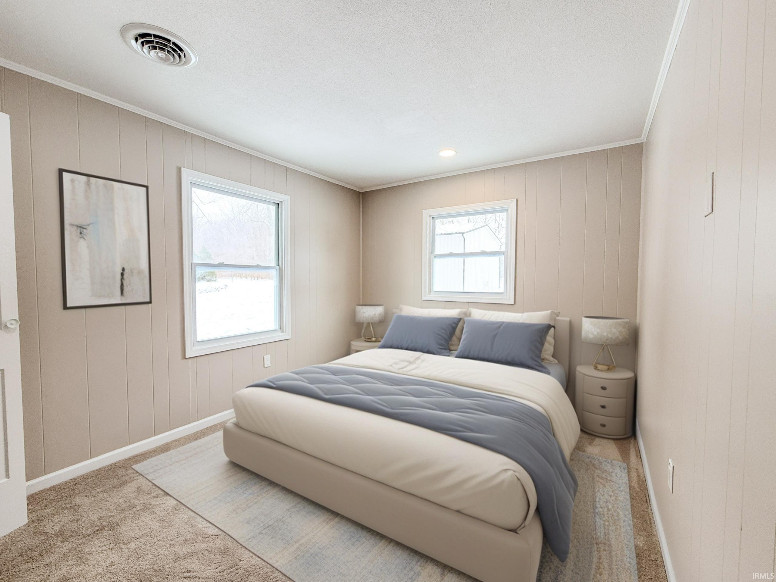 Bedroom featuring carpet, wood walls, and ornamental molding