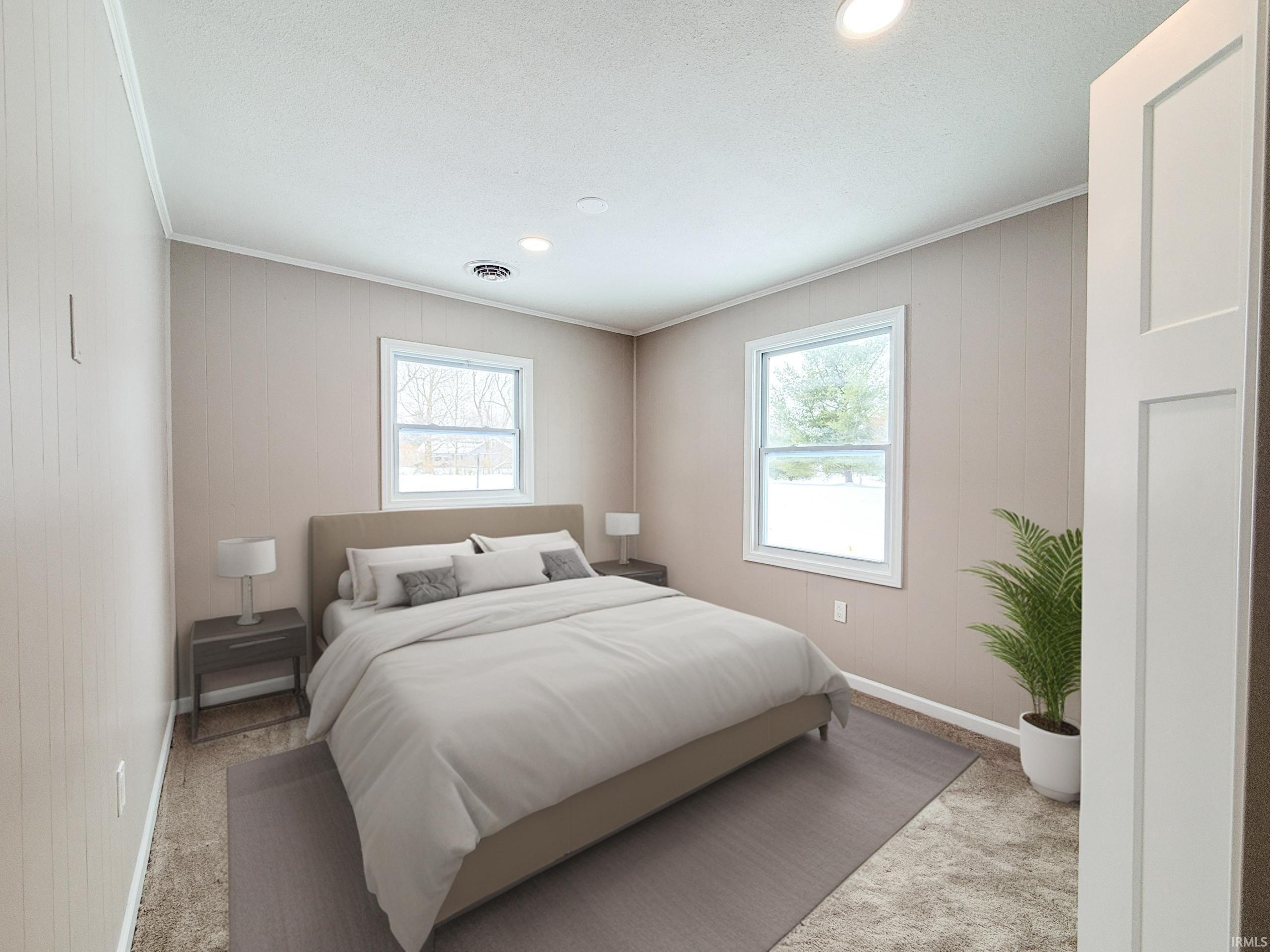 Bedroom featuring multiple windows, carpet floors, ornamental molding, a textured ceiling, and recessed lighting