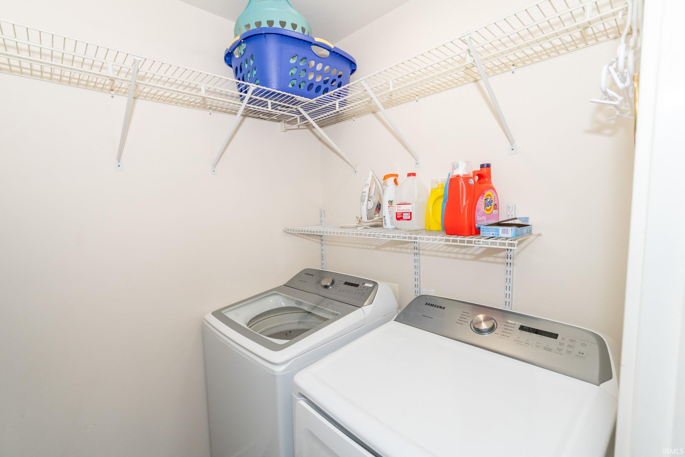 Laundry room featuring washing machine and clothes dryer
