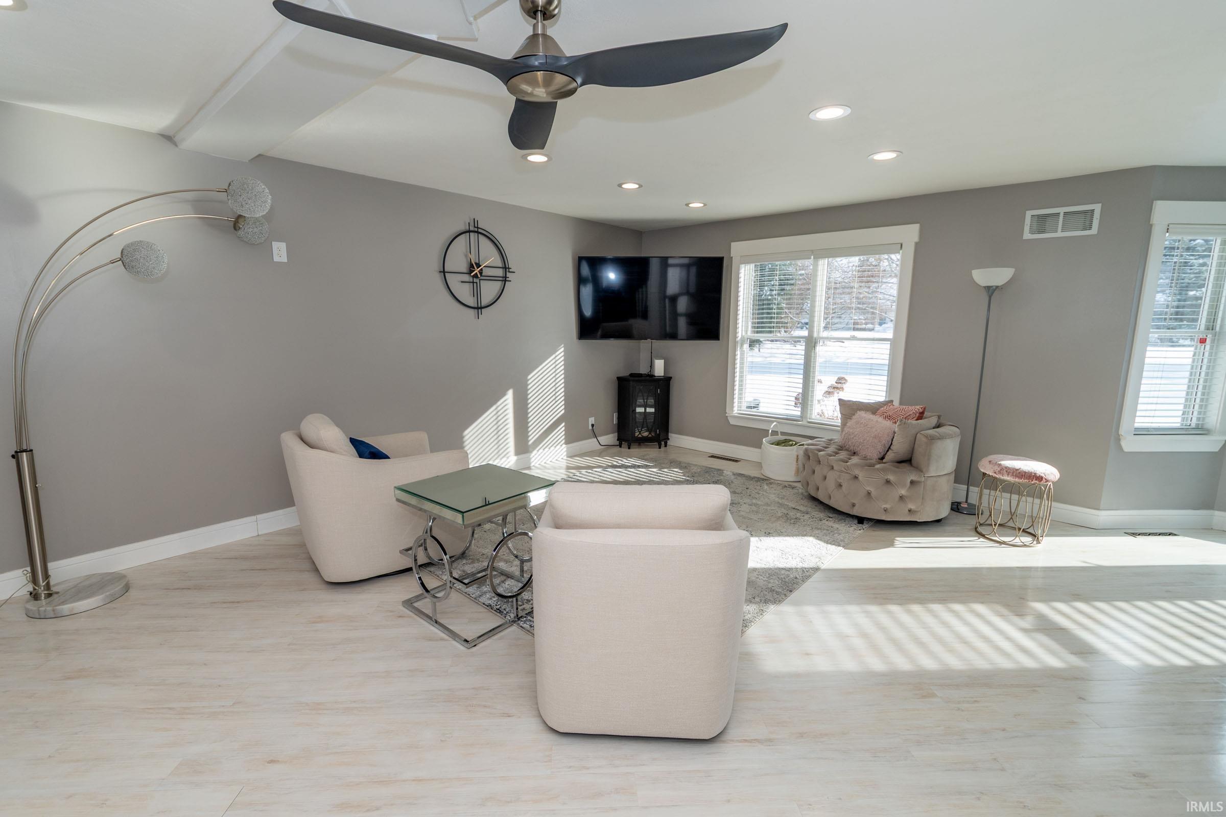 Living room featuring recessed lighting and ceiling fan