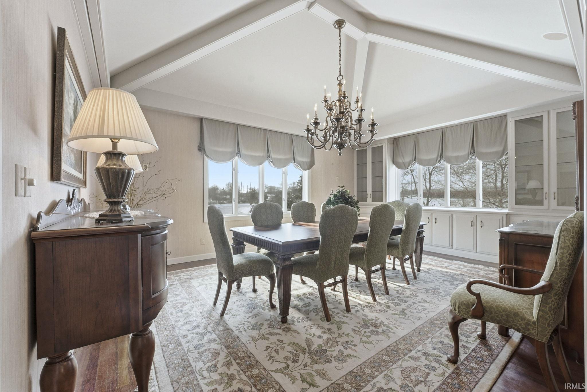 Dining space featuring a chandelier and wood finished floors