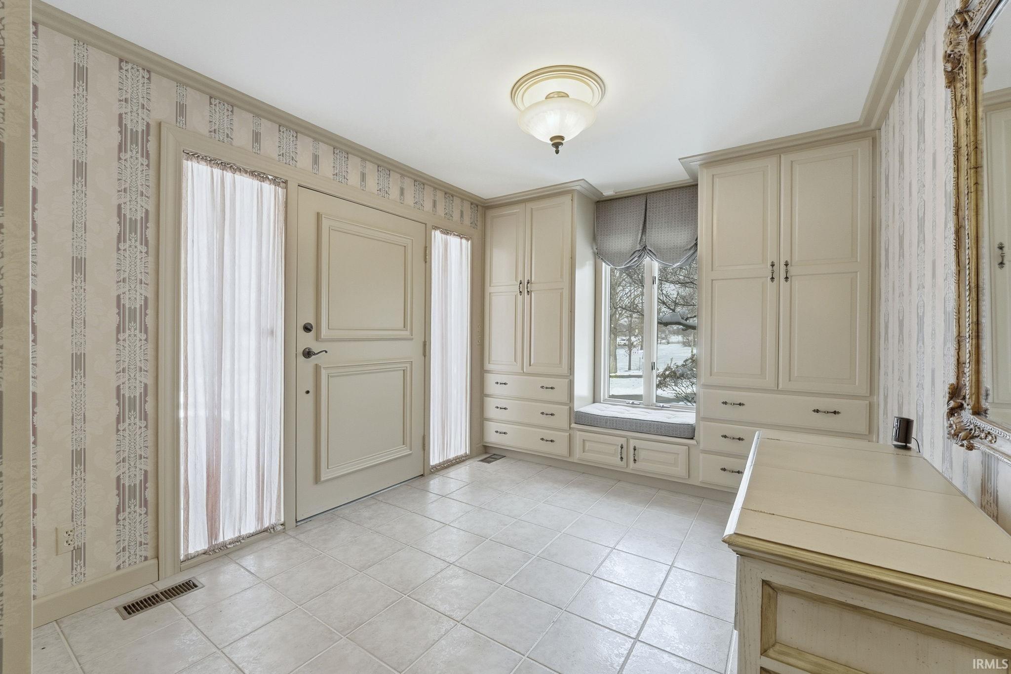 Entryway featuring light tile patterned floors