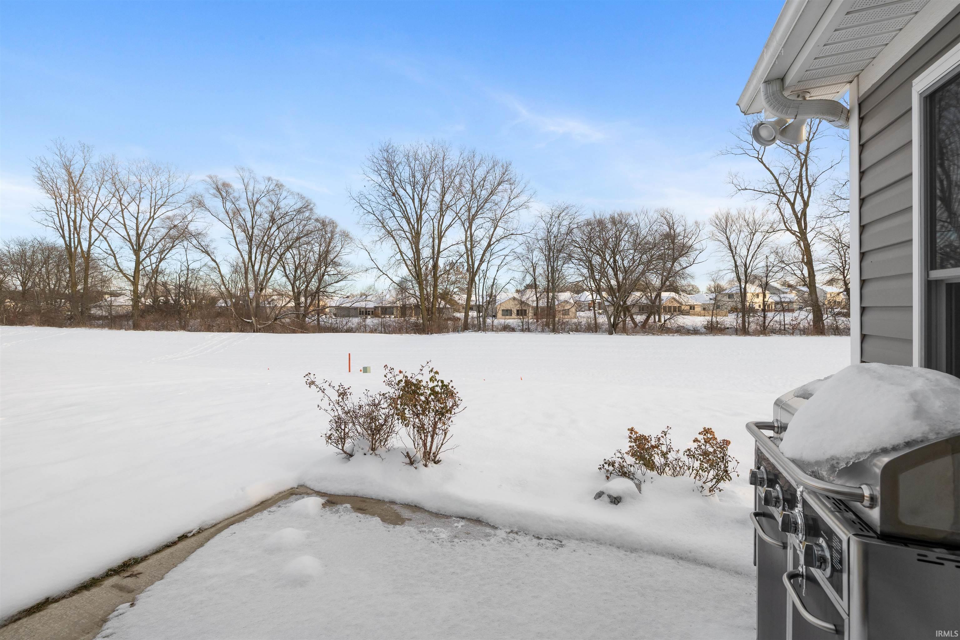 View of yard layered in snow