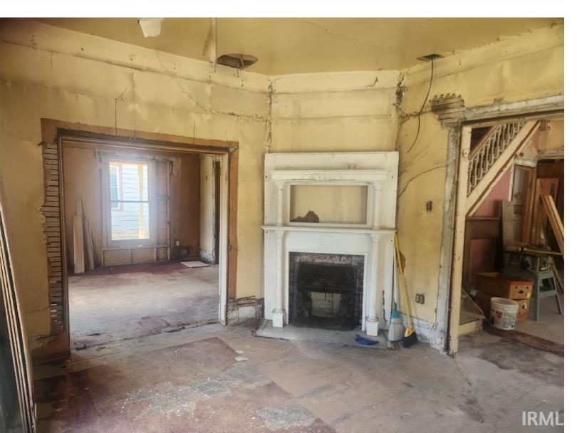 Unfurnished living room with a fireplace