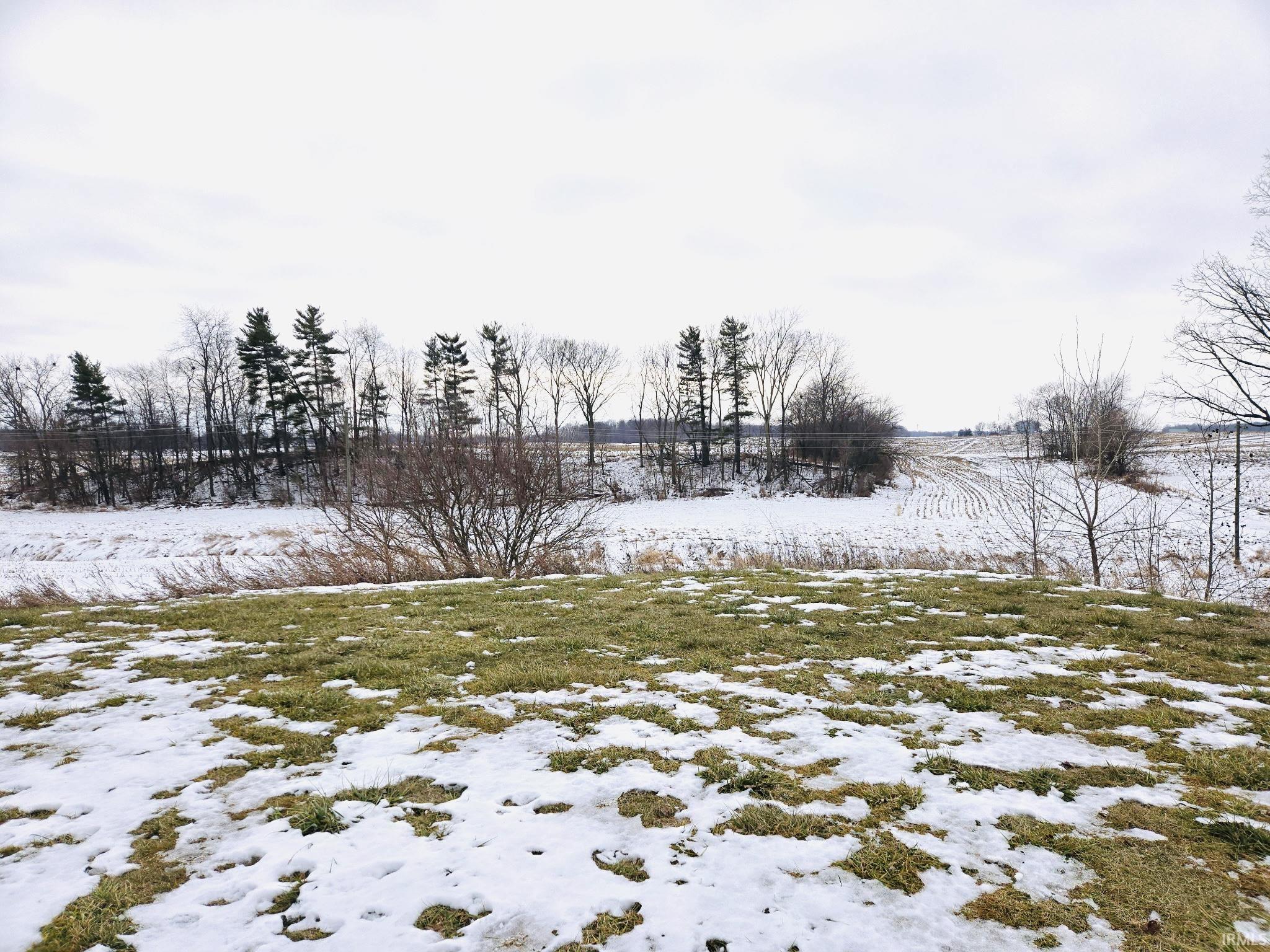 View of yard layered in snow