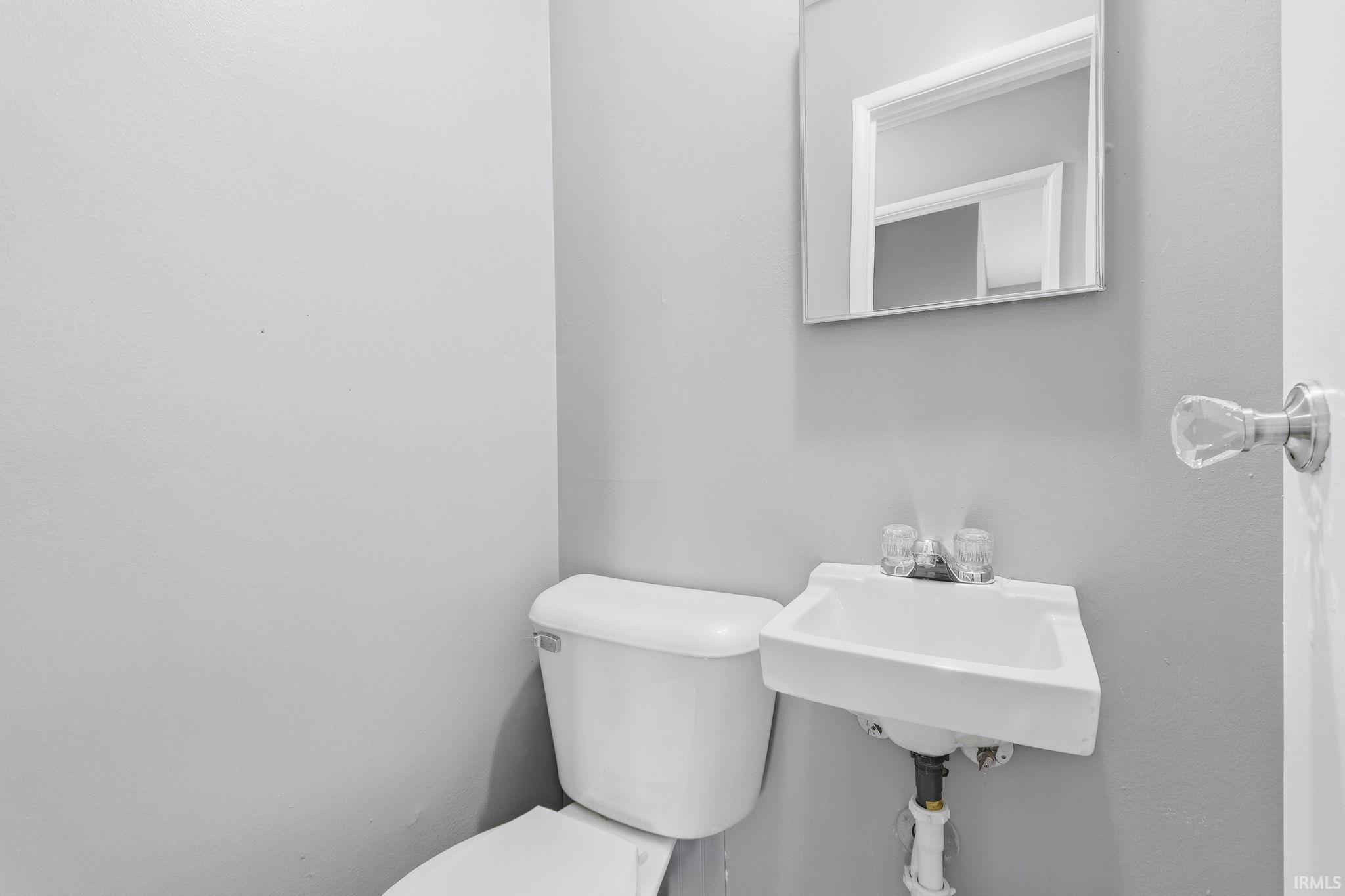 Half bath featuring toilet