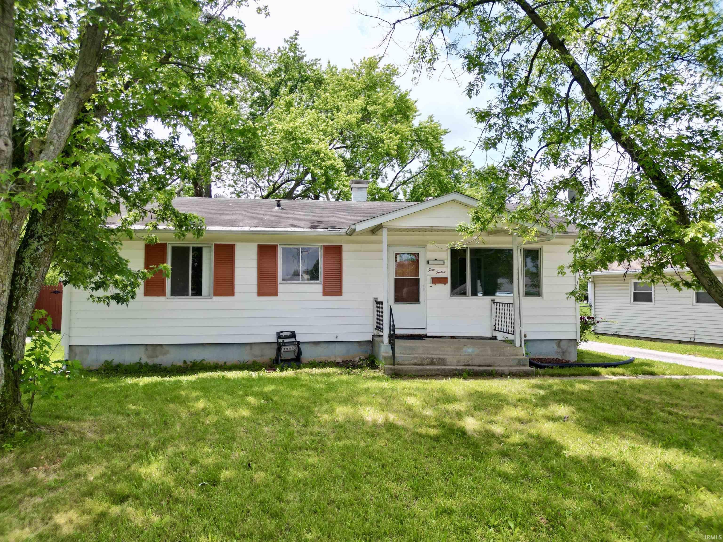White siding exterior with red shutters