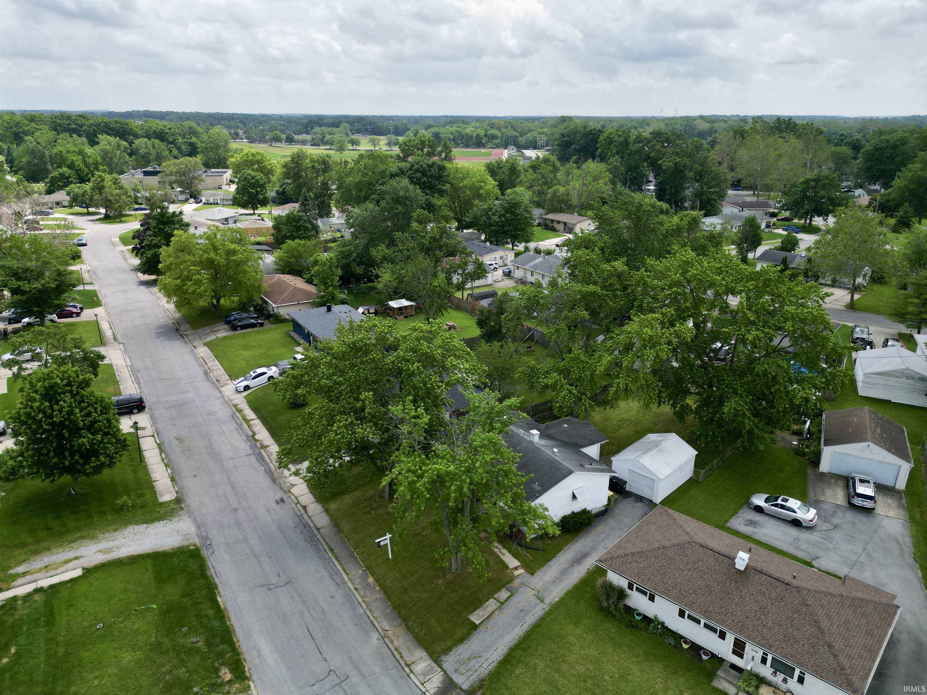 Residential street with established trees and green lawns