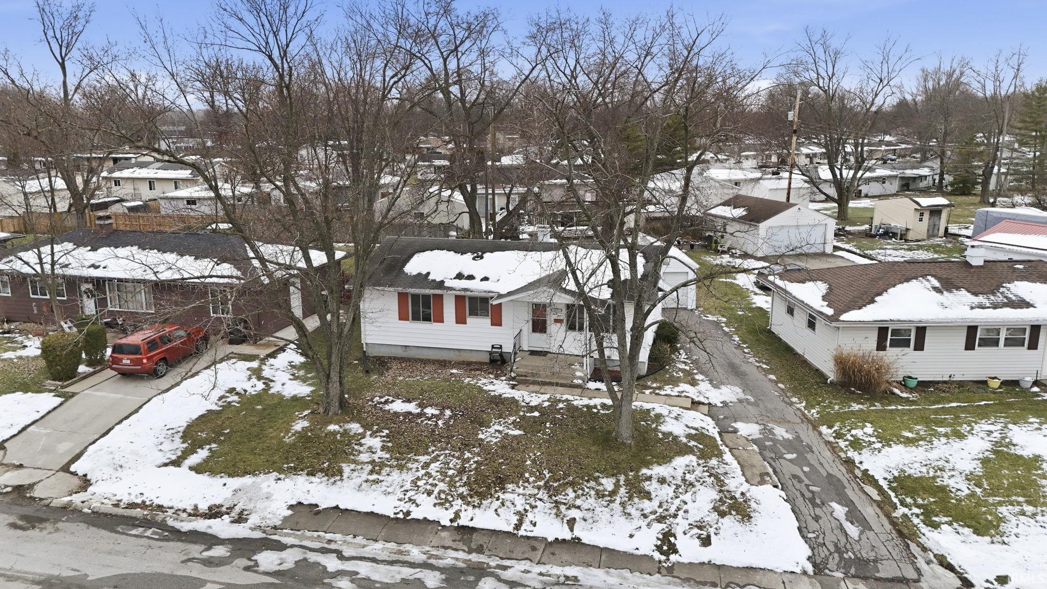 Snowy aerial view with a residential view