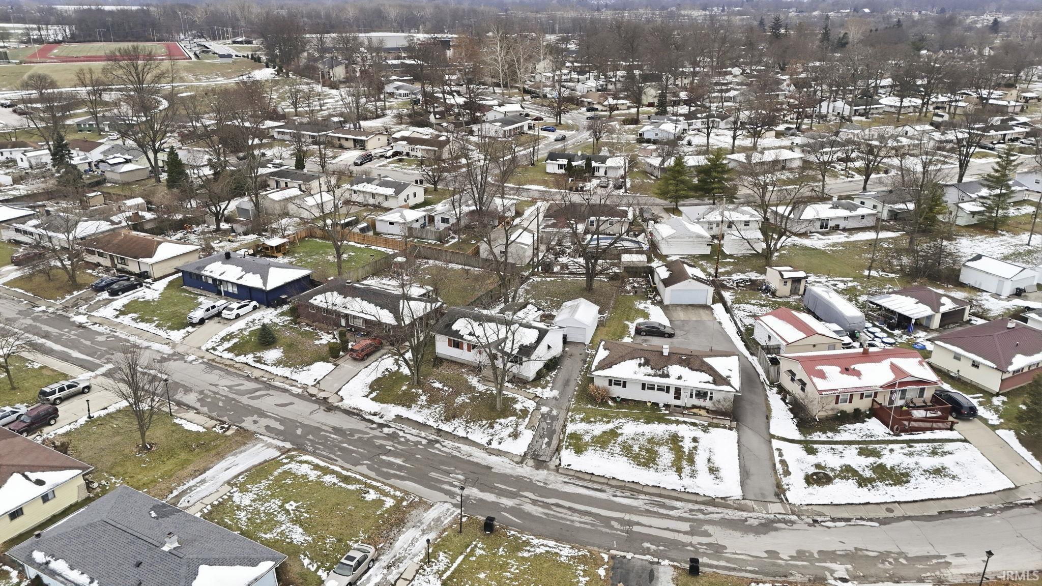 View of property location with nearby suburban area