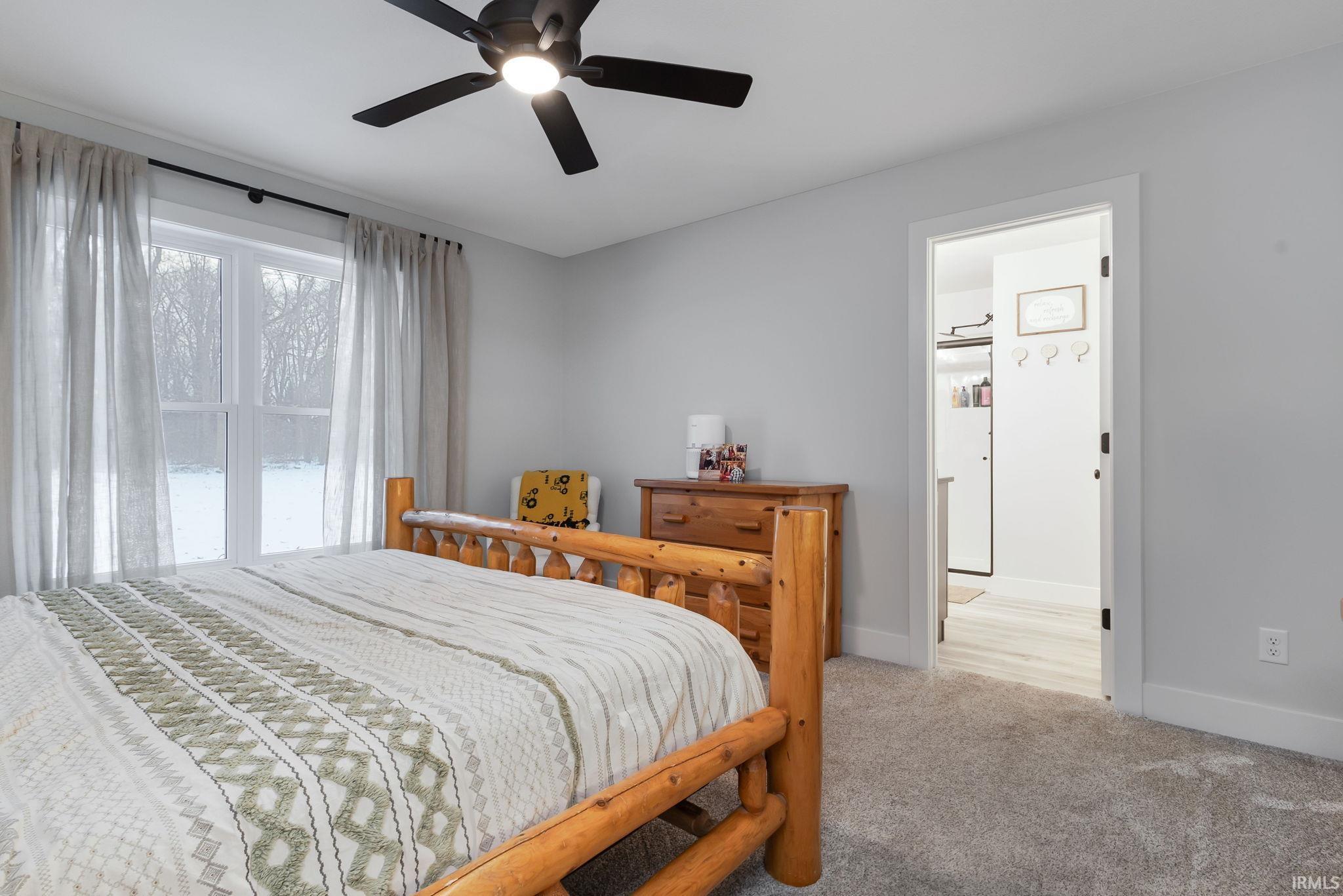 Bedroom featuring carpet and a ceiling fan