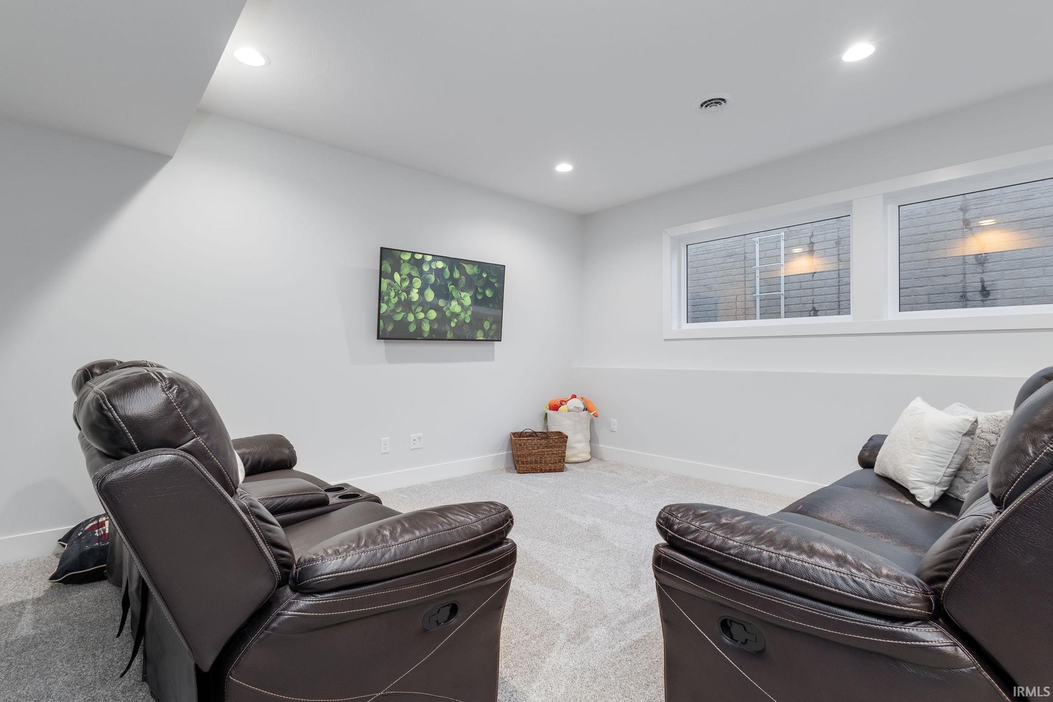 Sitting room featuring carpet and recessed lighting