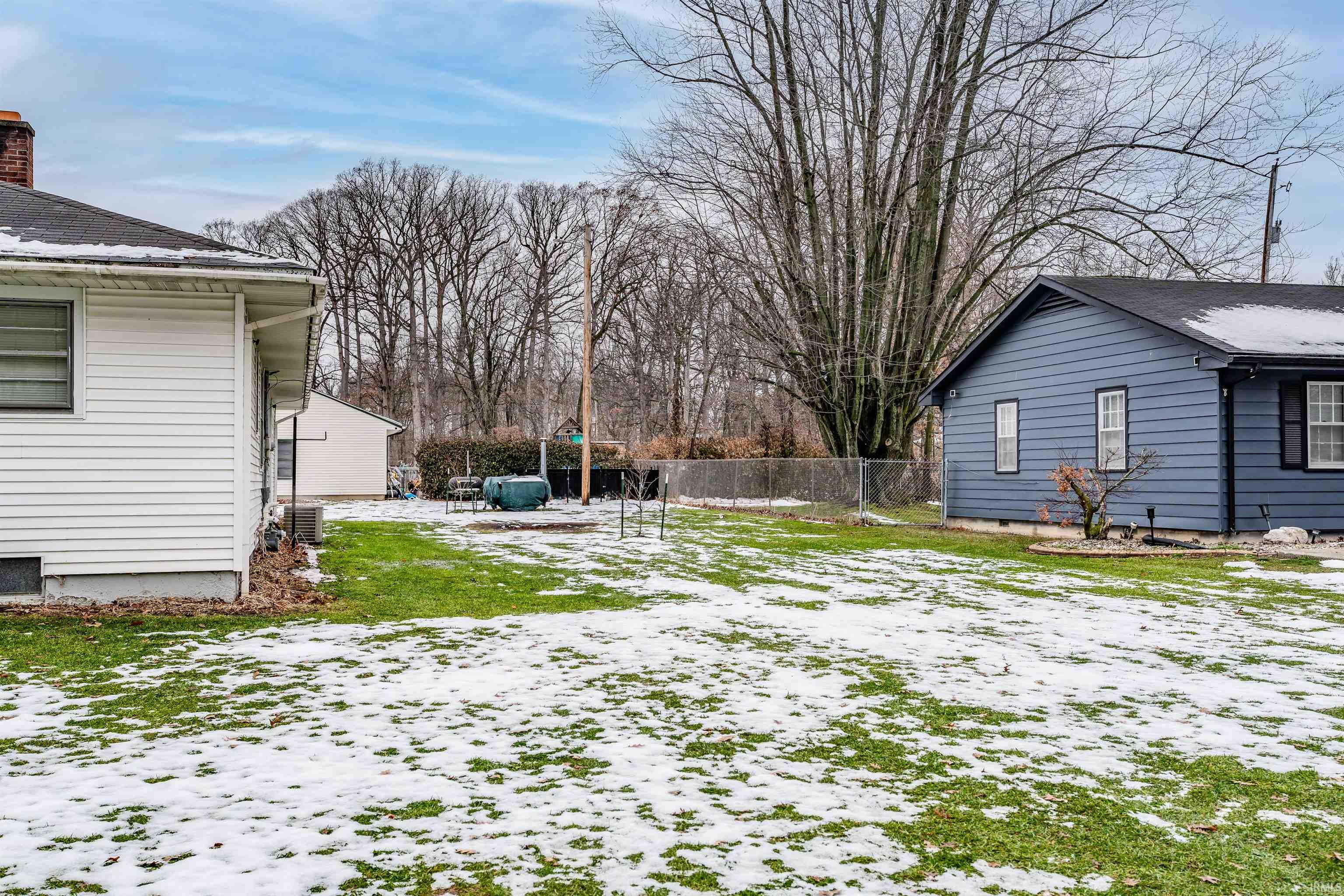 View of yard layered in snow