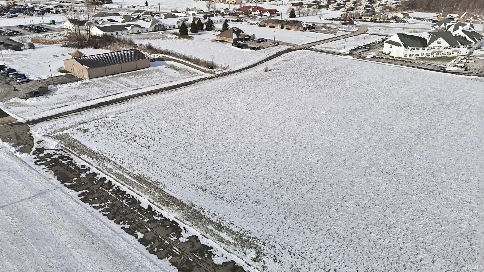 Snowy aerial view with a residential view