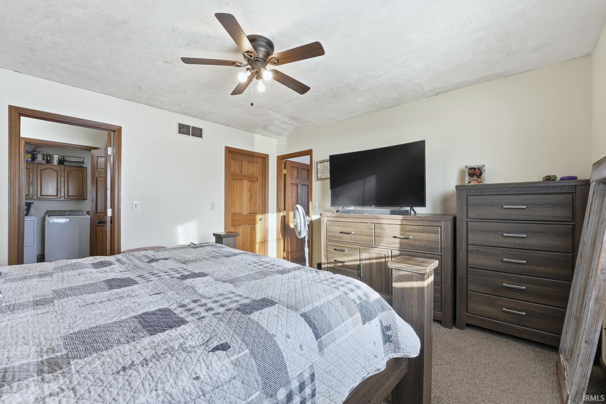 Bedroom with carpet floors and ceiling fan