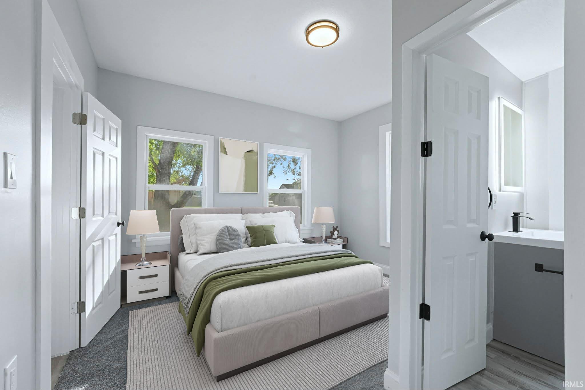 Bedroom featuring a sink