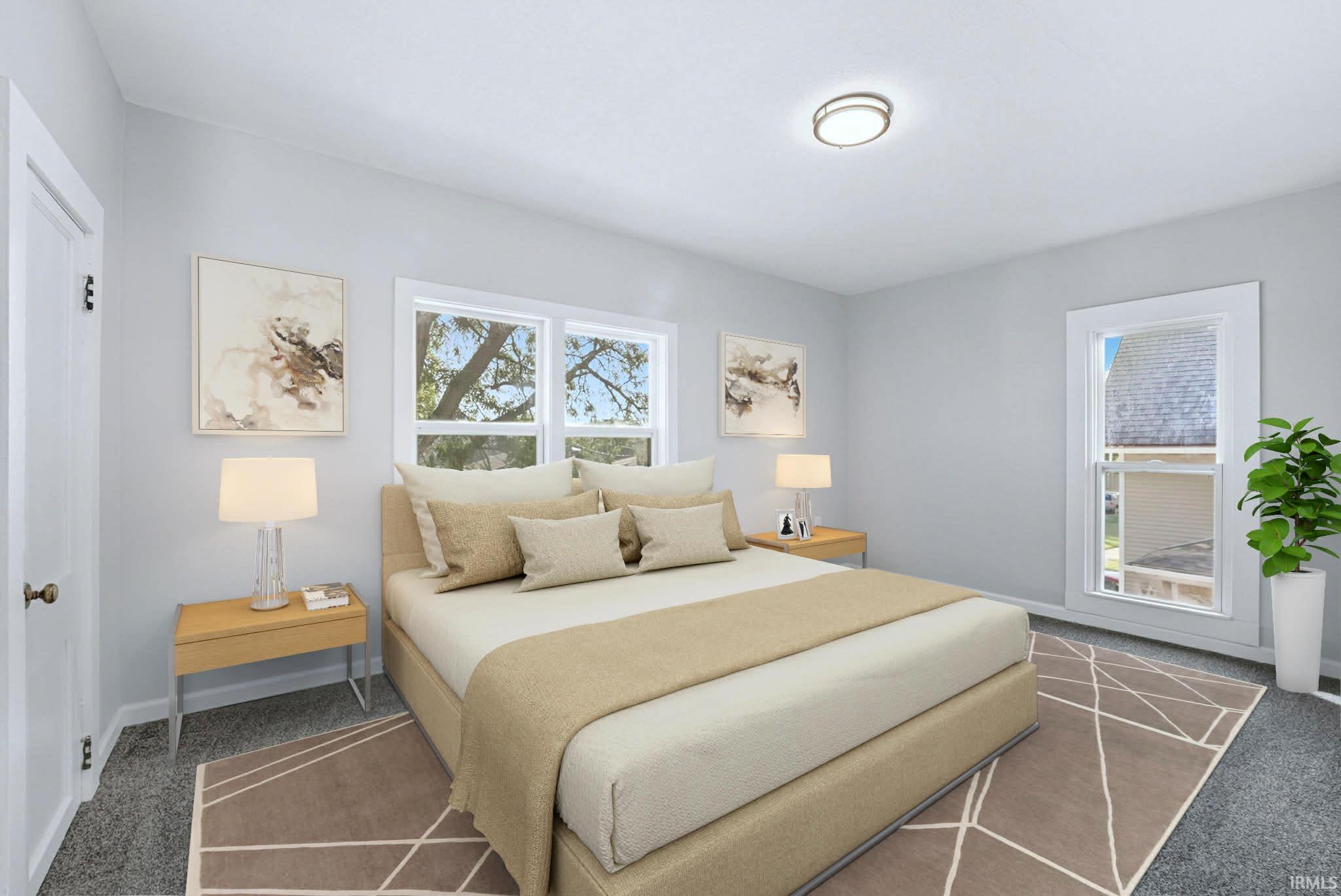 Carpeted bedroom with baseboards