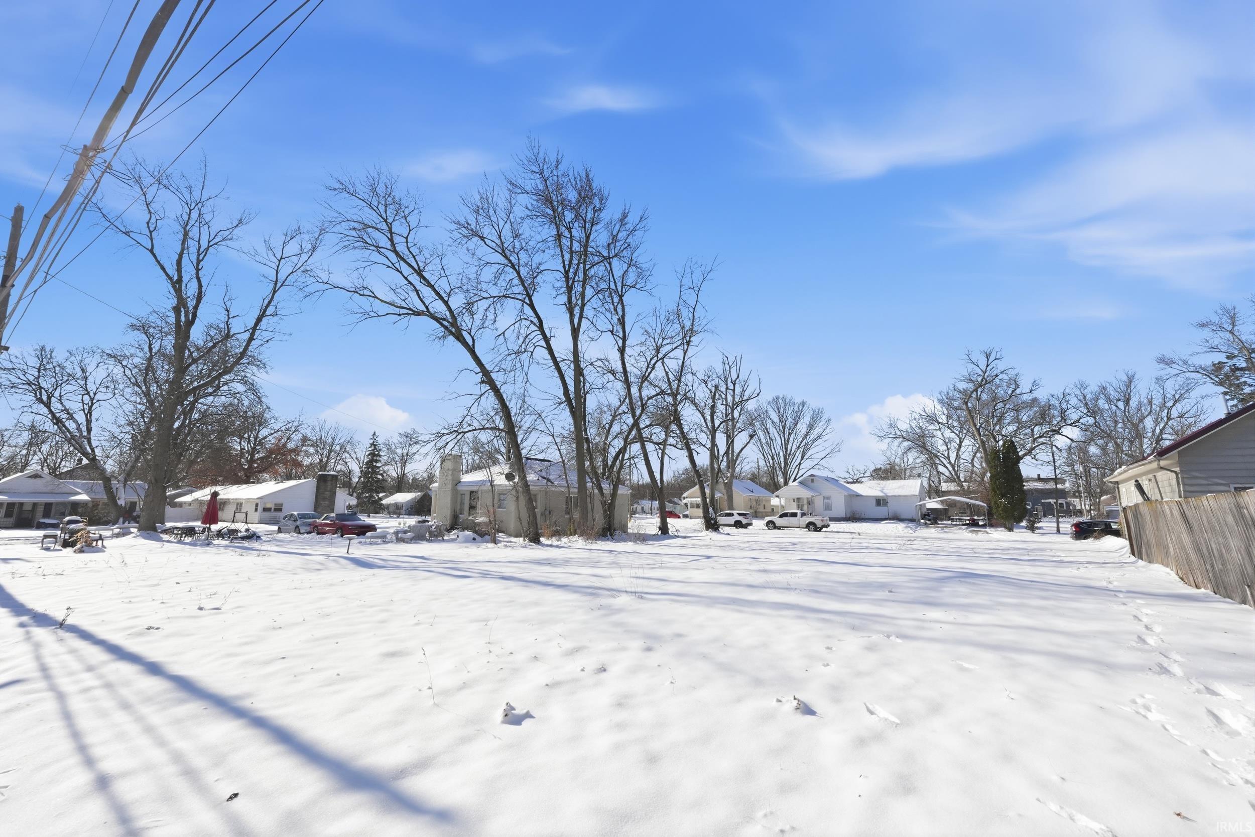 View of yard covered in snow