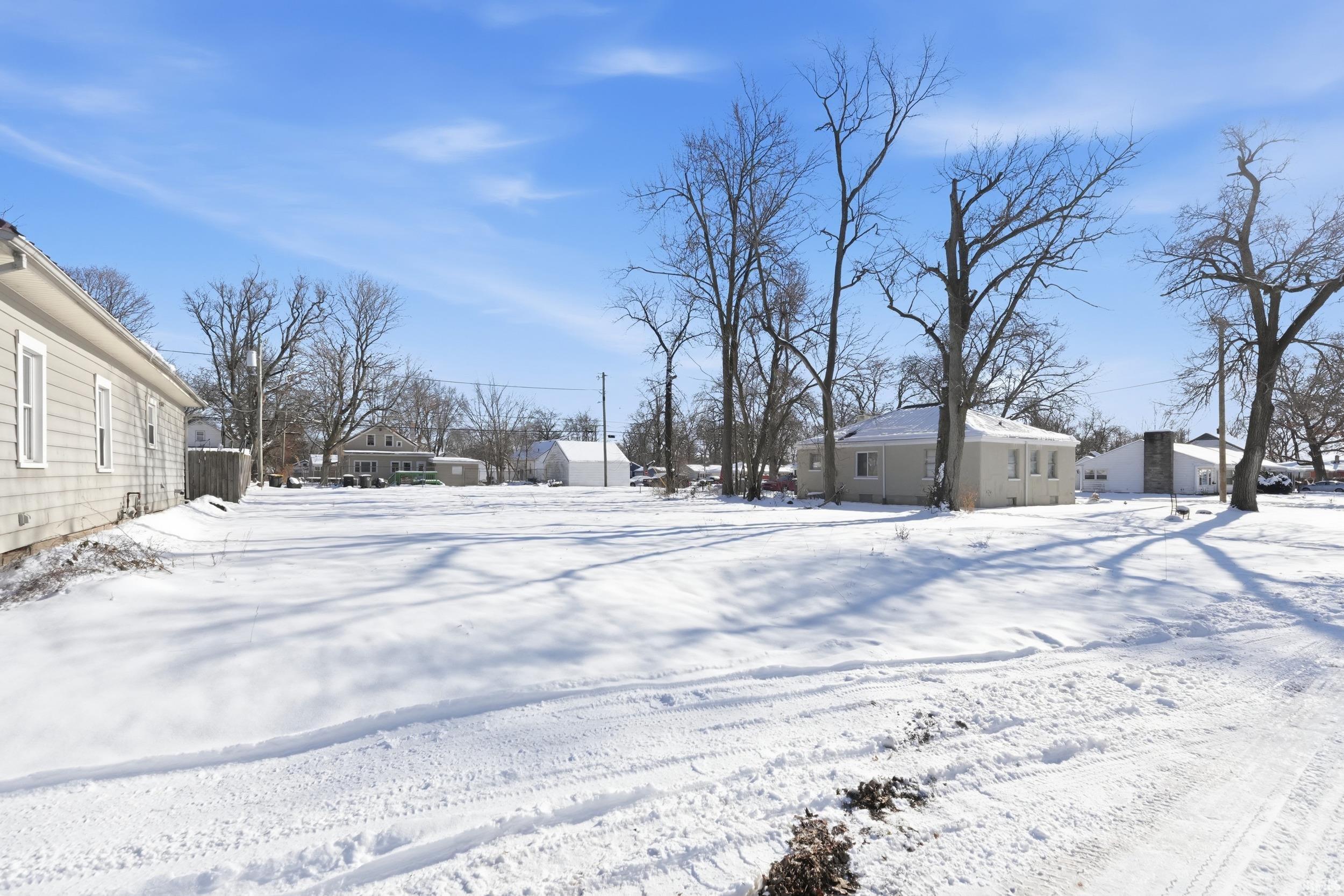 View of yard covered in snow