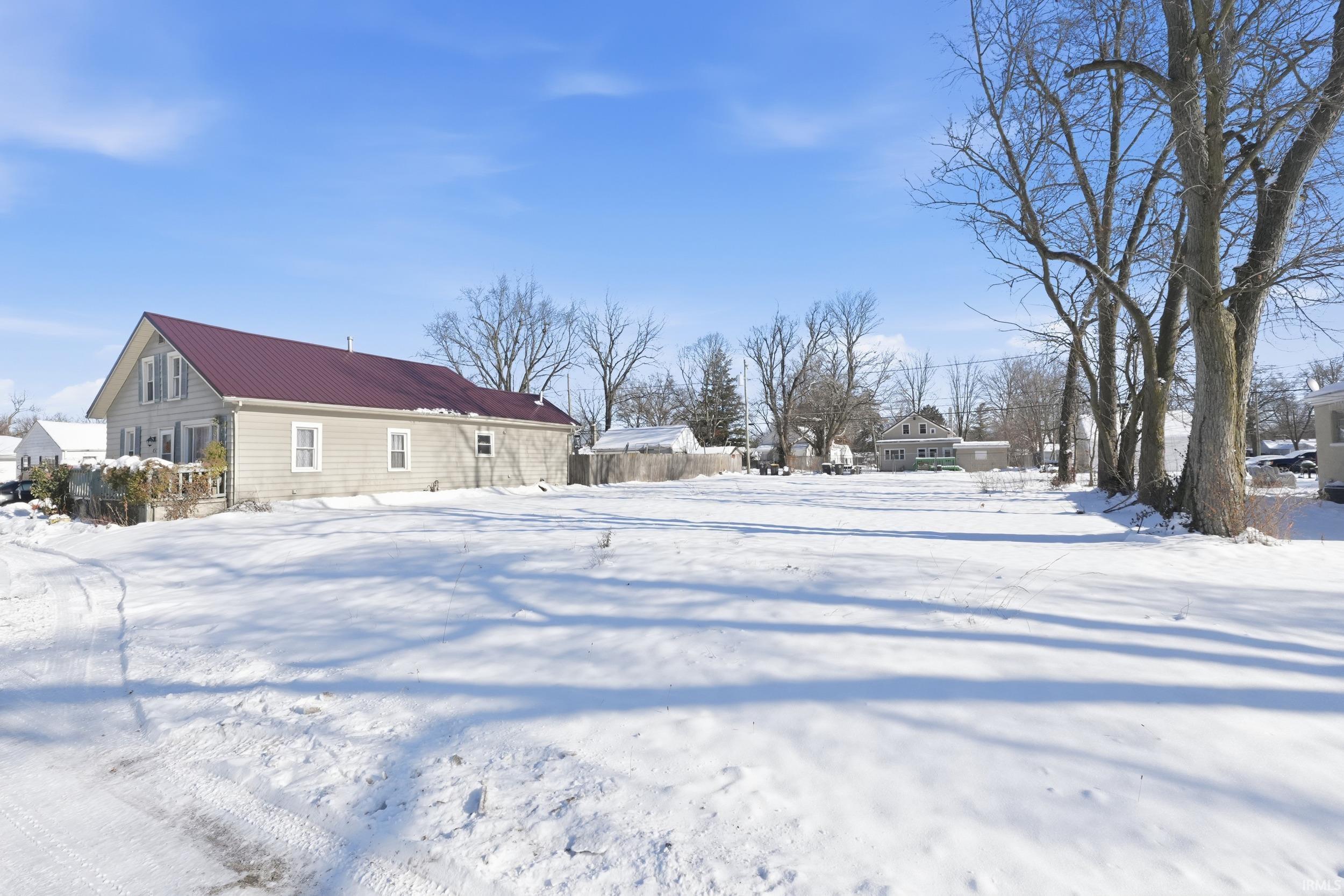View of yard covered in snow