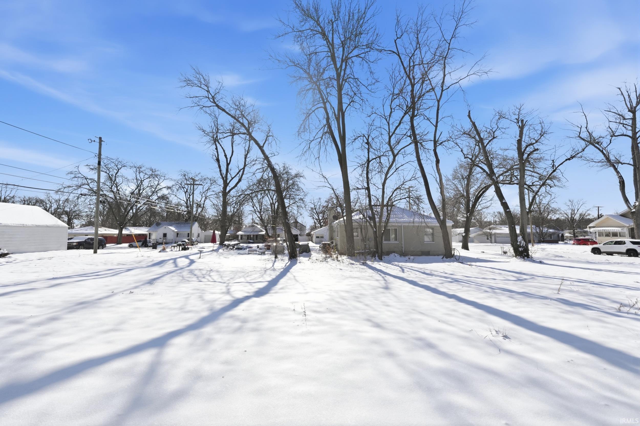 View of yard layered in snow