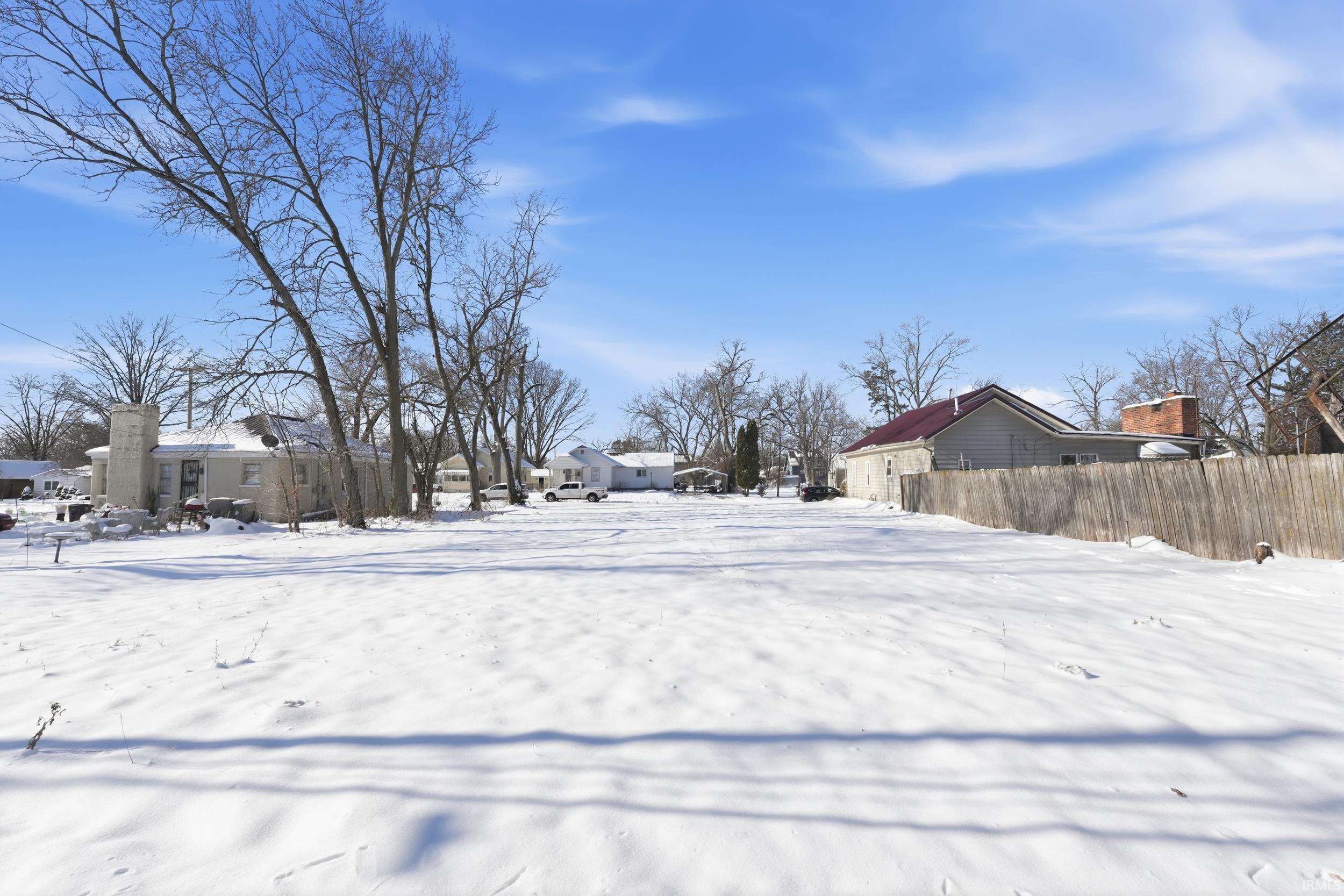 View of yard layered in snow