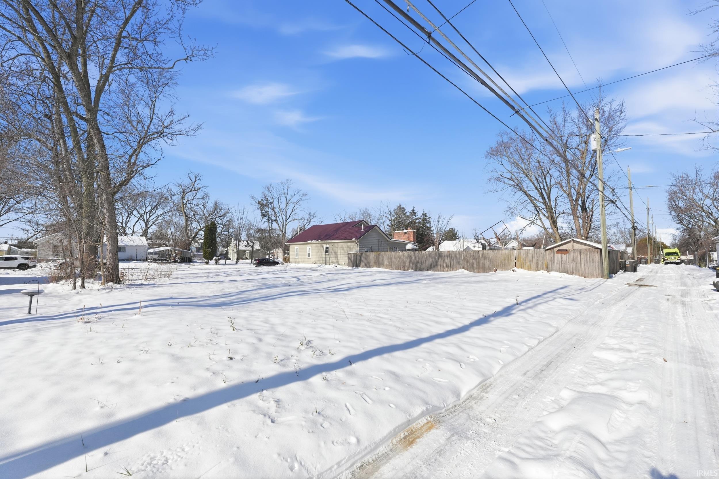 View of yard layered in snow