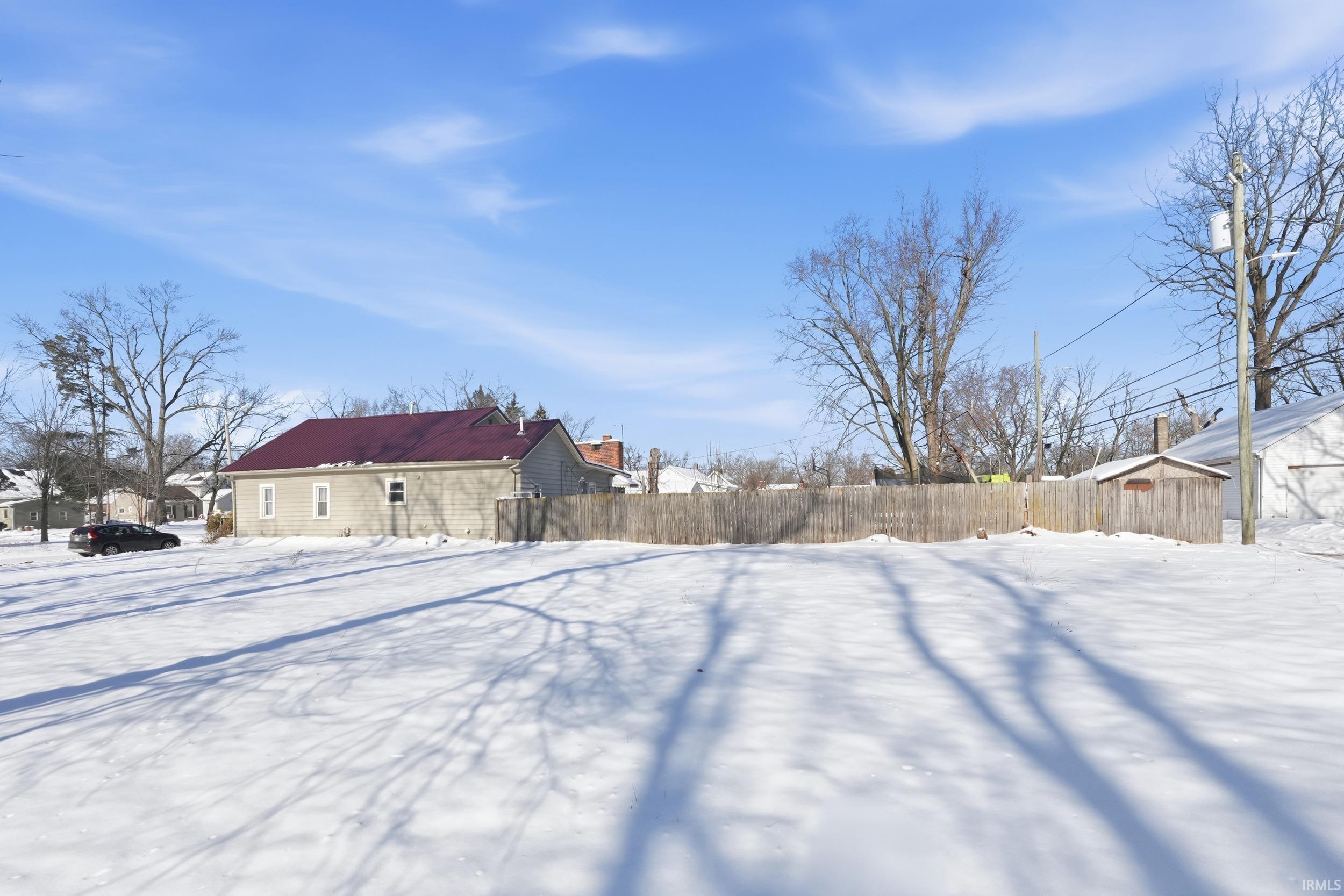 View of yard covered in snow