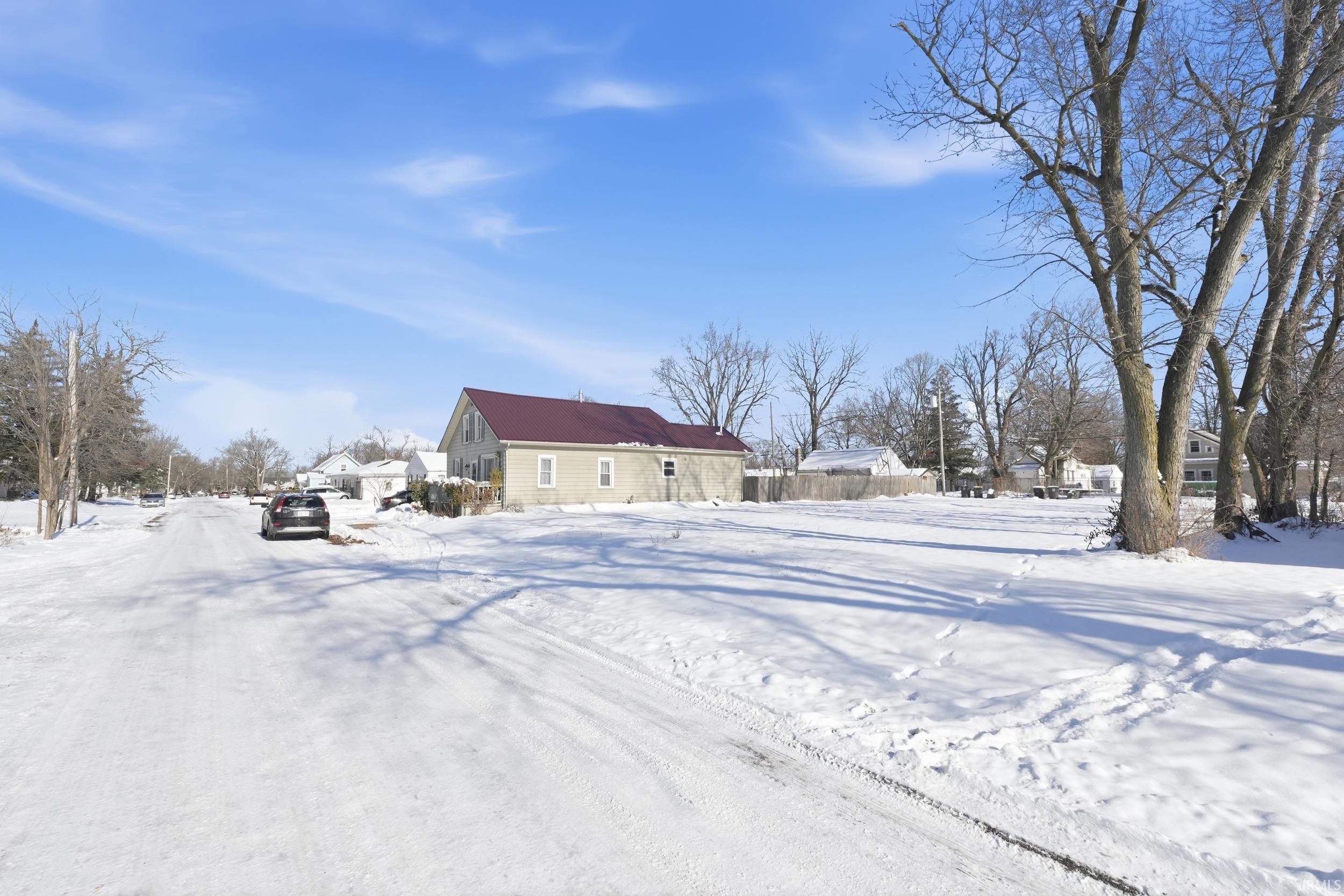 View of yard layered in snow