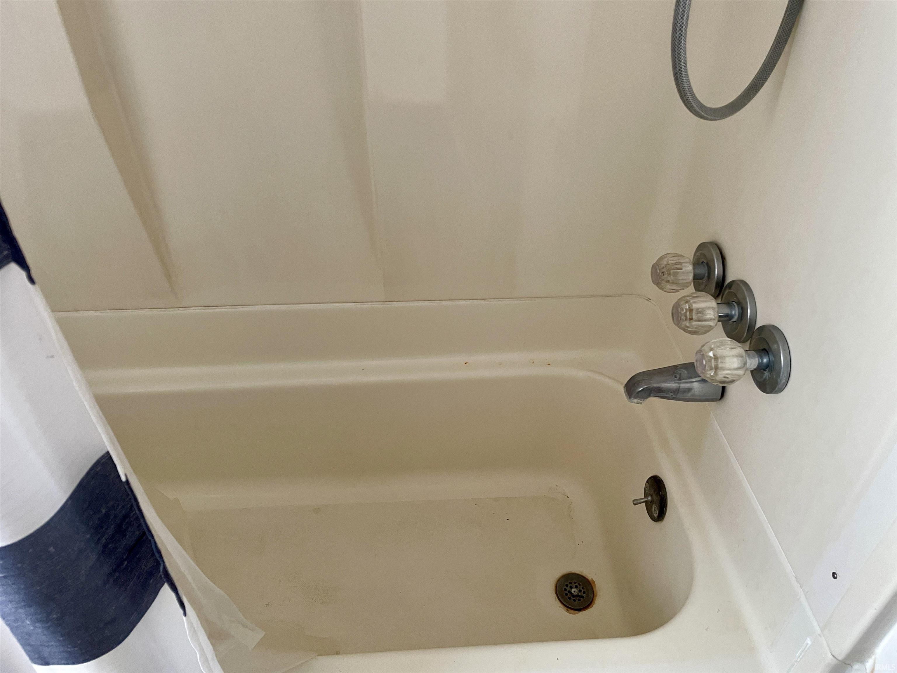 Full bath featuring shower / bath combination with curtain