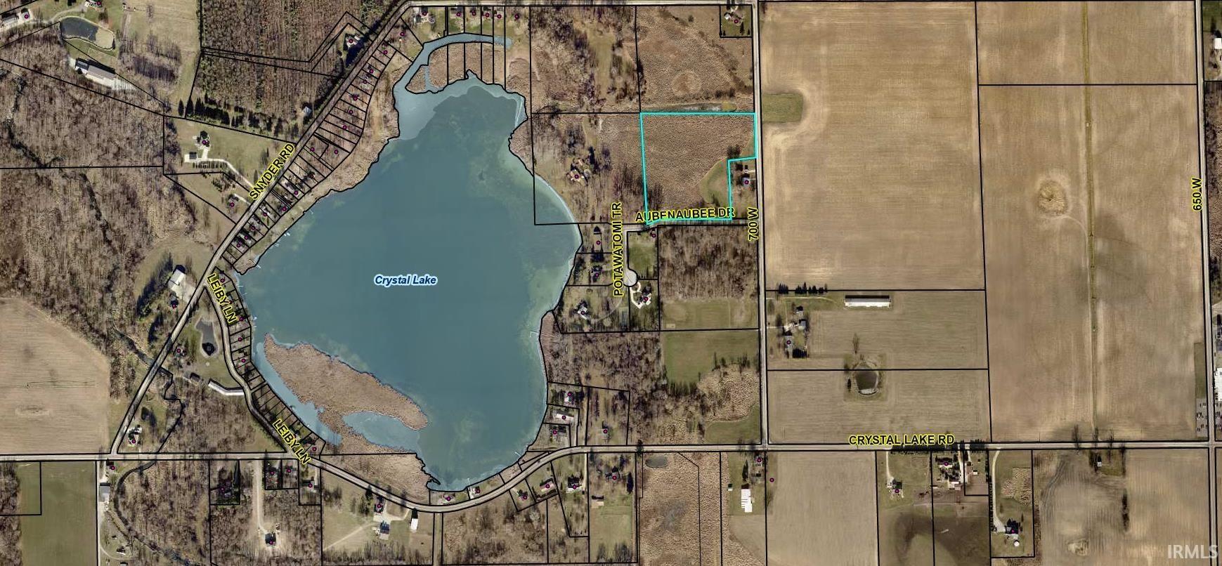 Aerial overview of property's location with property parcel outlined
