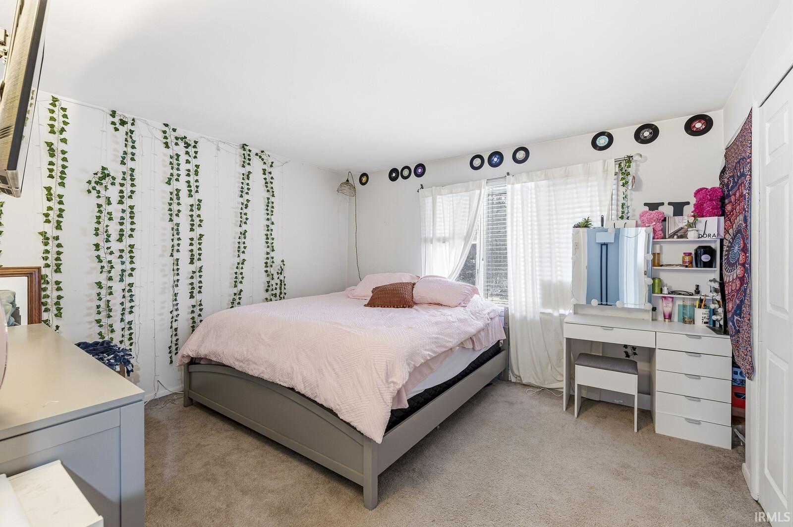 Bedroom with light carpet