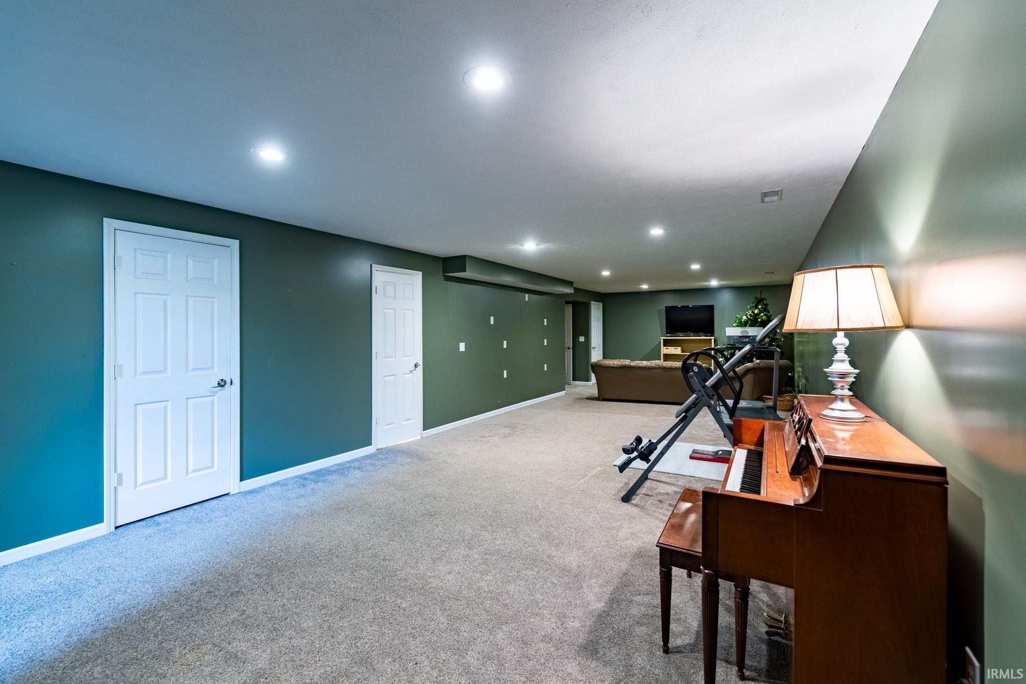 Office area with recessed lighting and carpet flooring