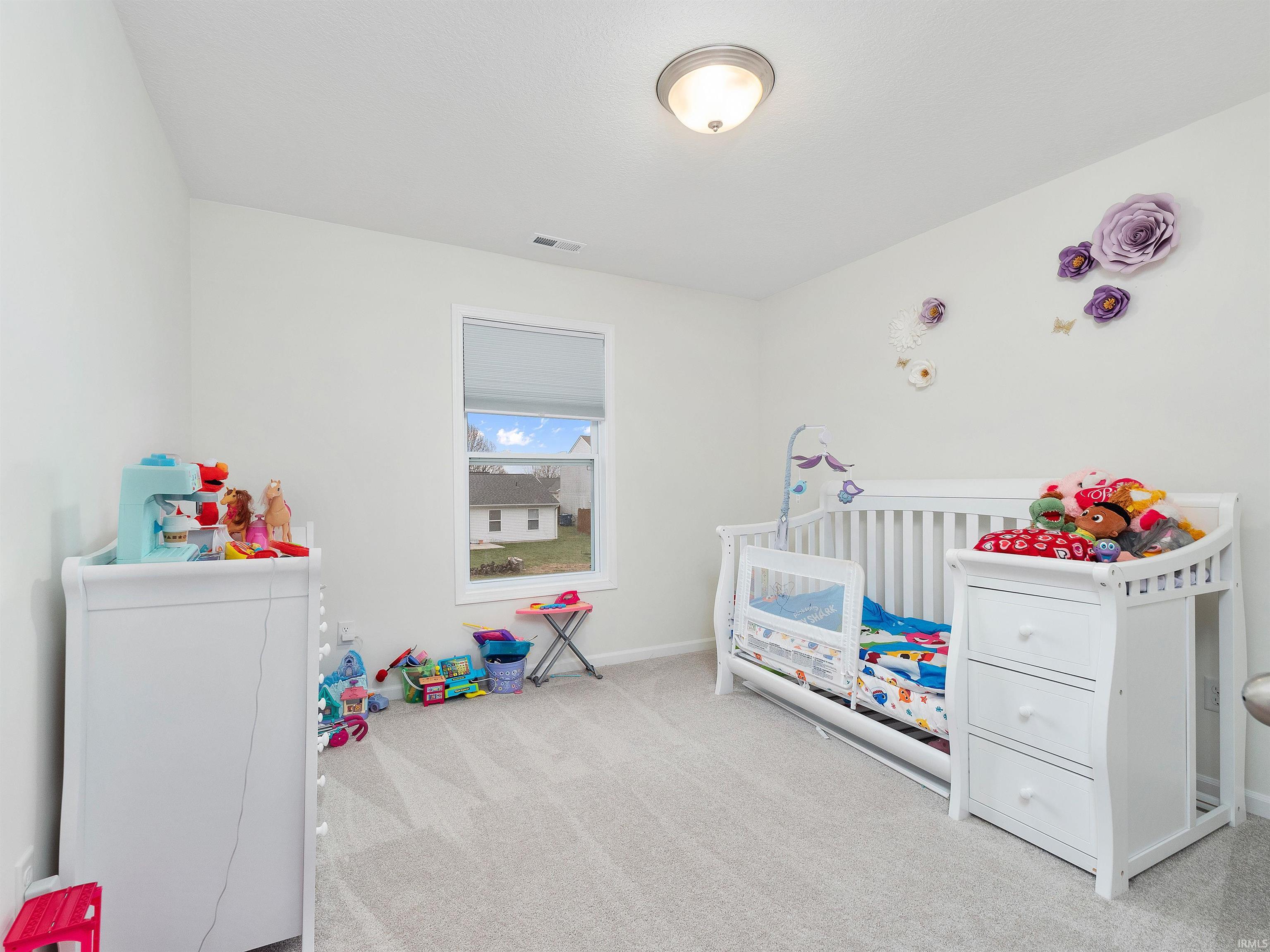 Bedroom with carpet and baseboards