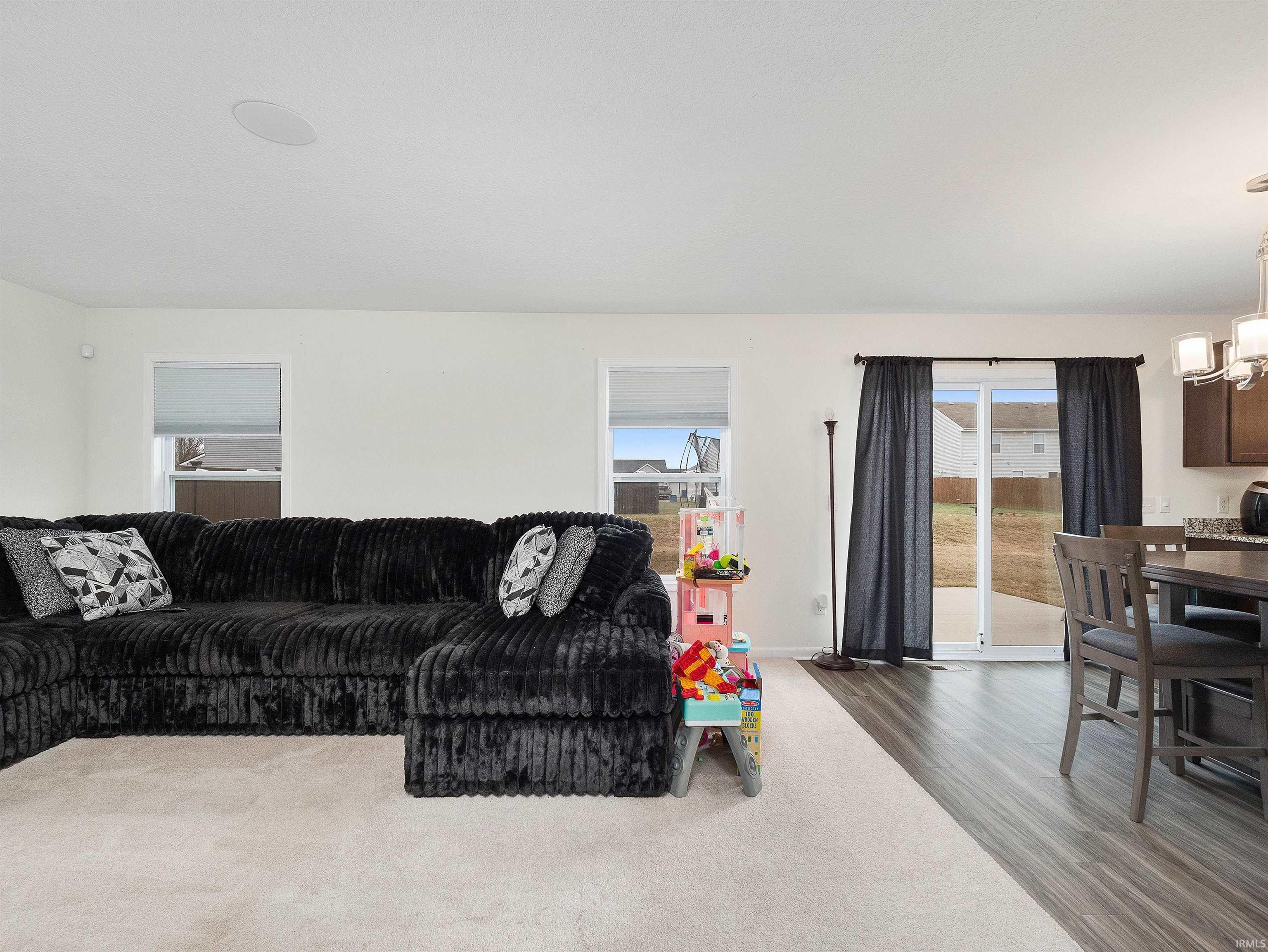 Living room featuring a chandelier and wood finished floors
