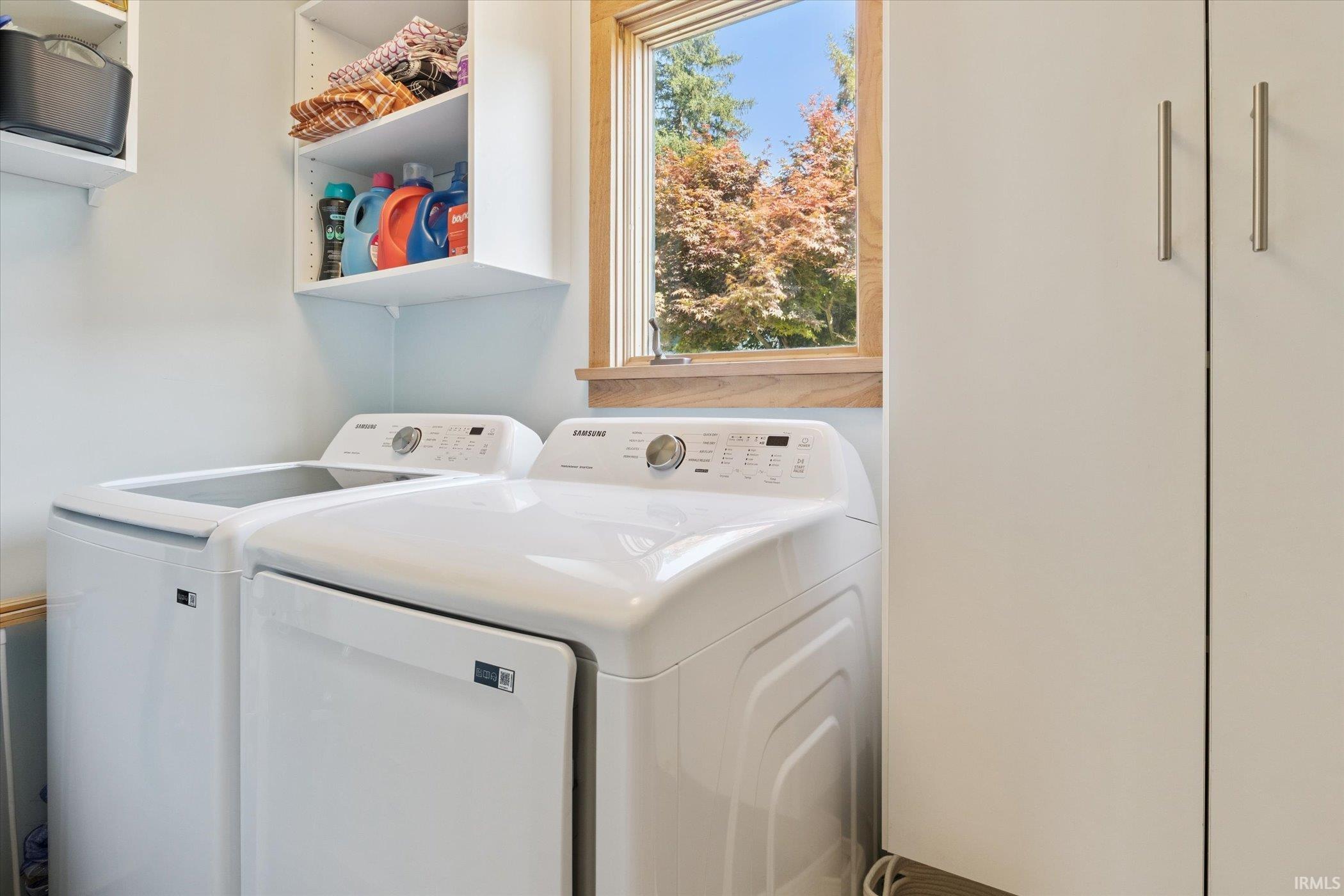 Washroom with washing machine and dryer