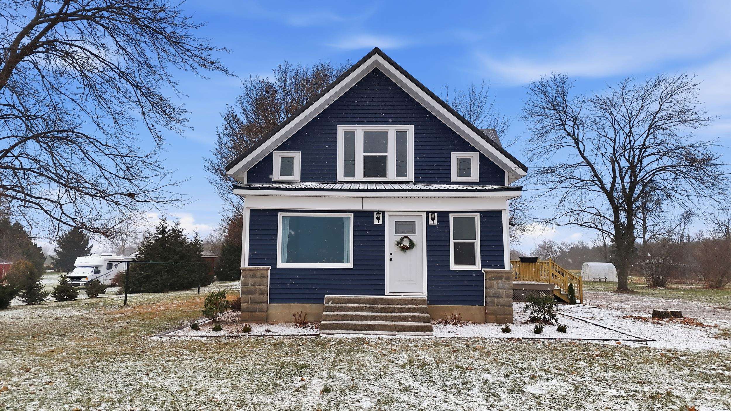 View of front of house featuring a metal roof