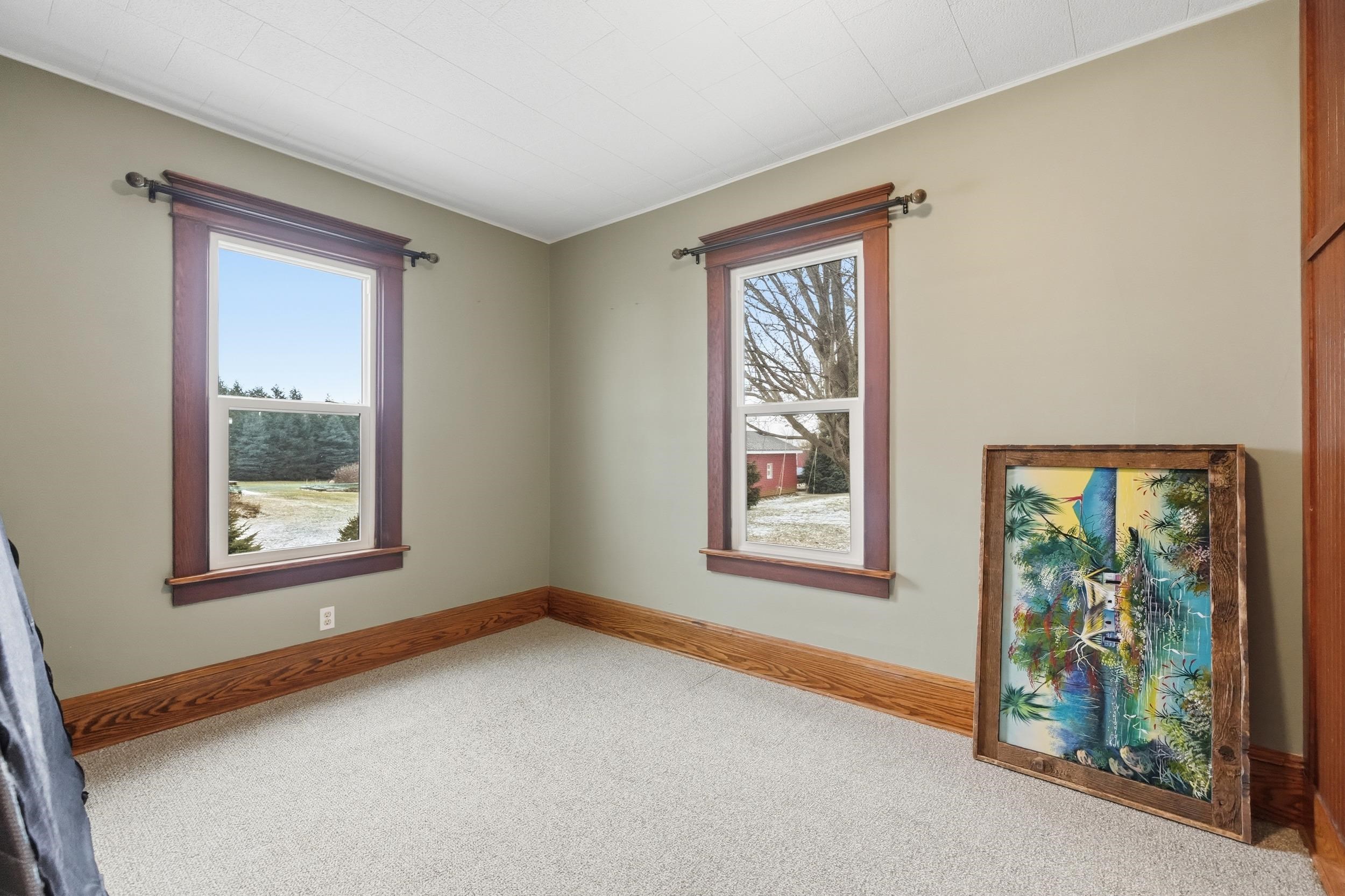 Empty room with carpet and plenty of natural light