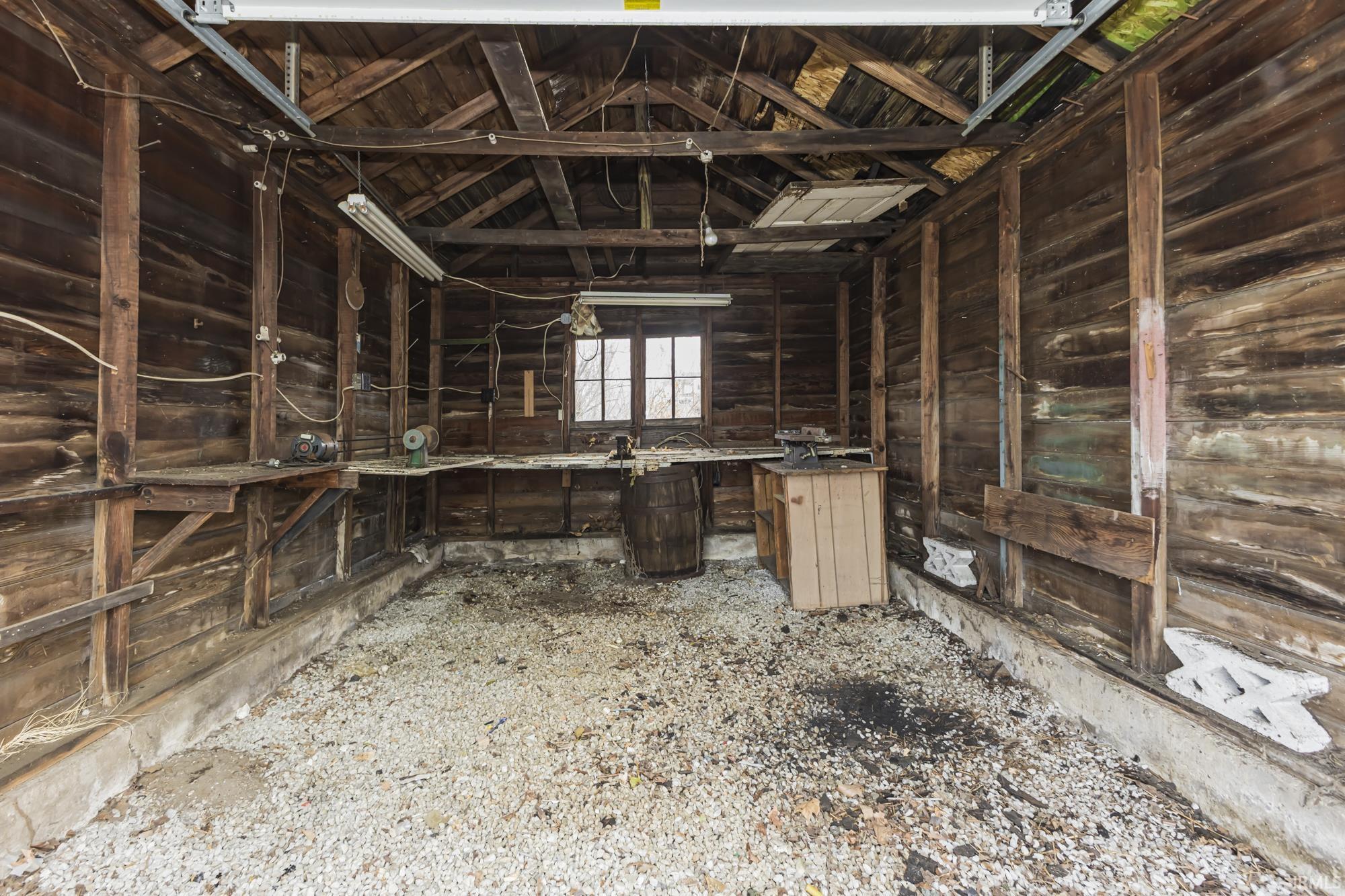Miscellaneous room with lofted ceiling