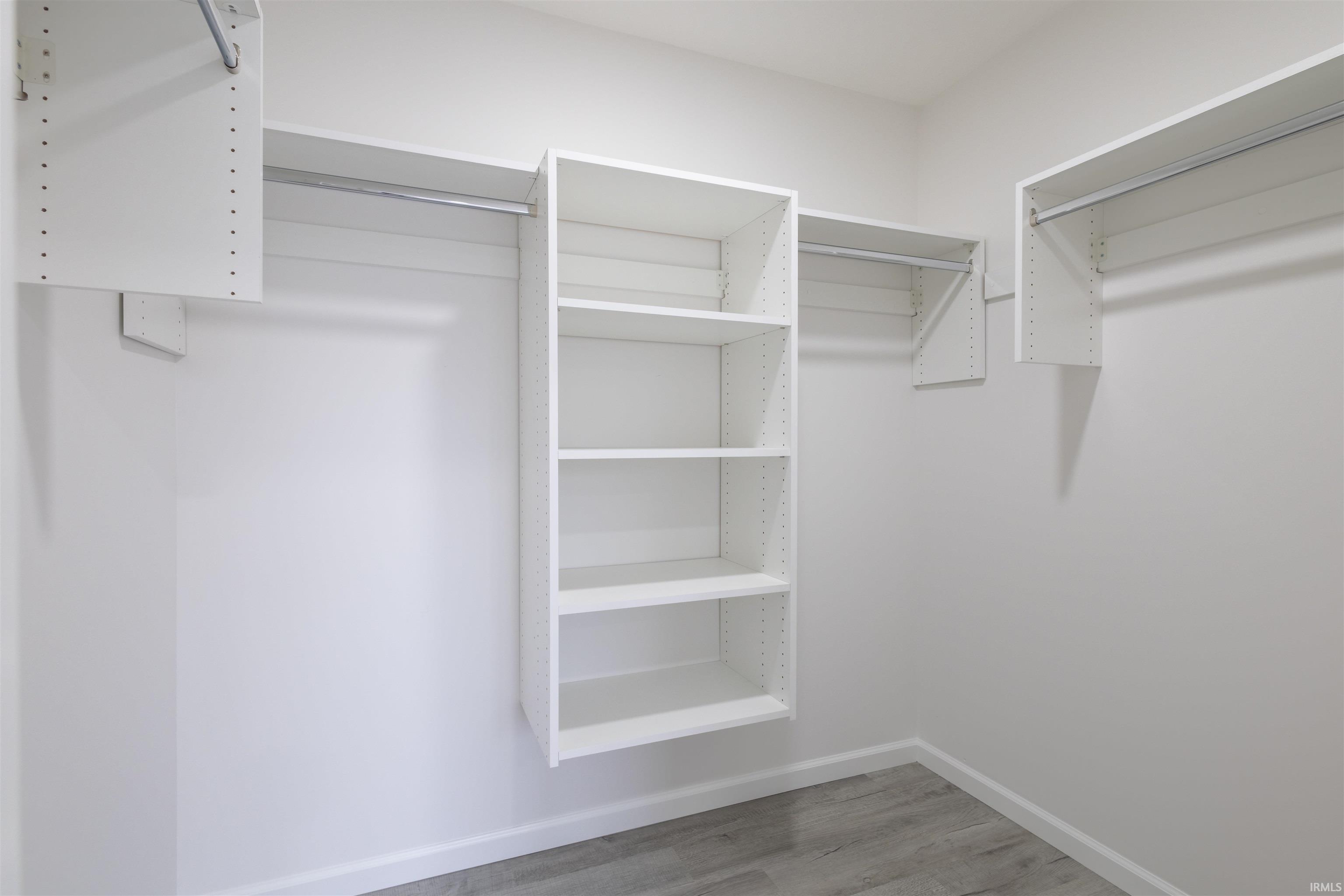 Spacious closet featuring light wood-style floors