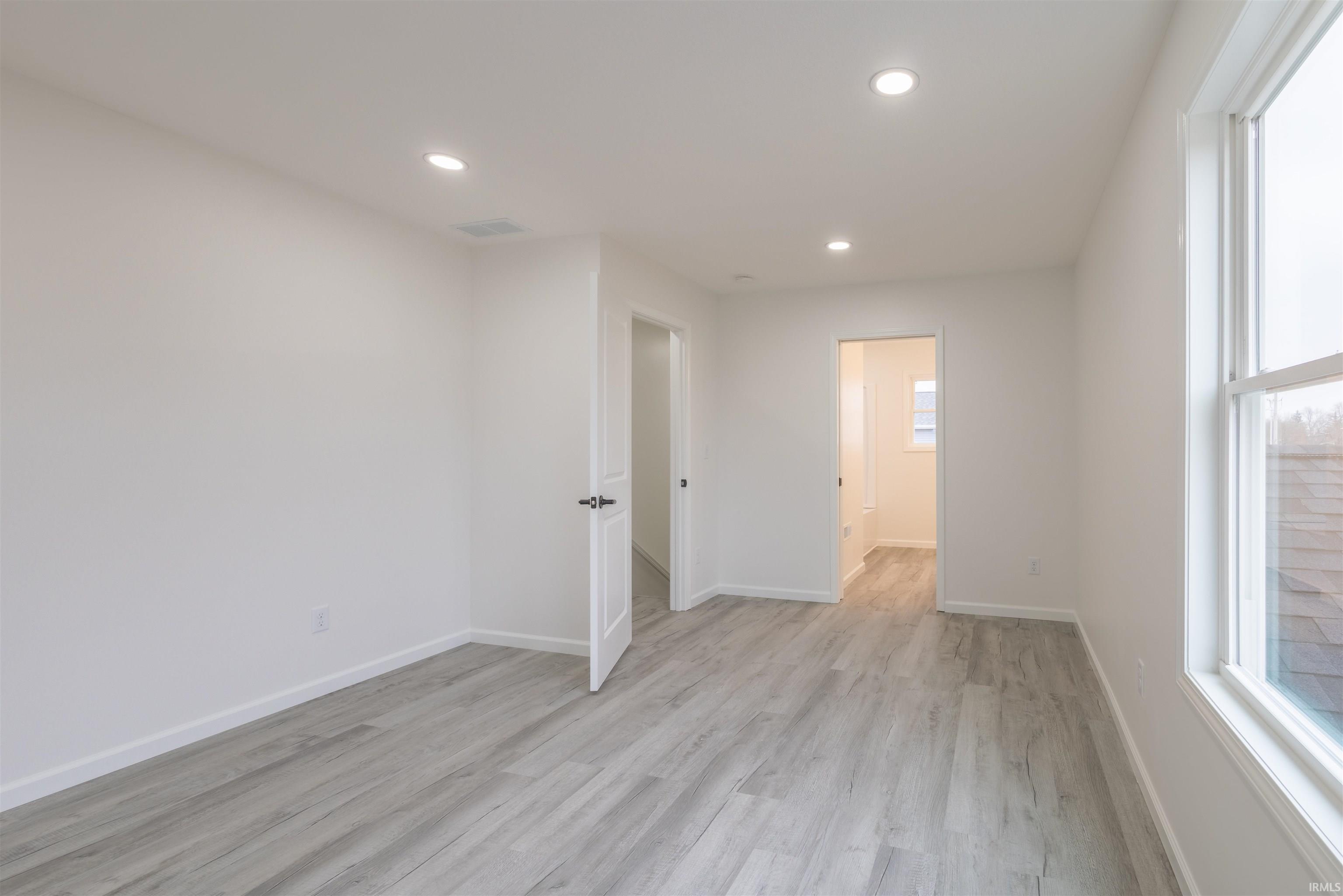 Unfurnished room featuring recessed lighting and light wood-style floors