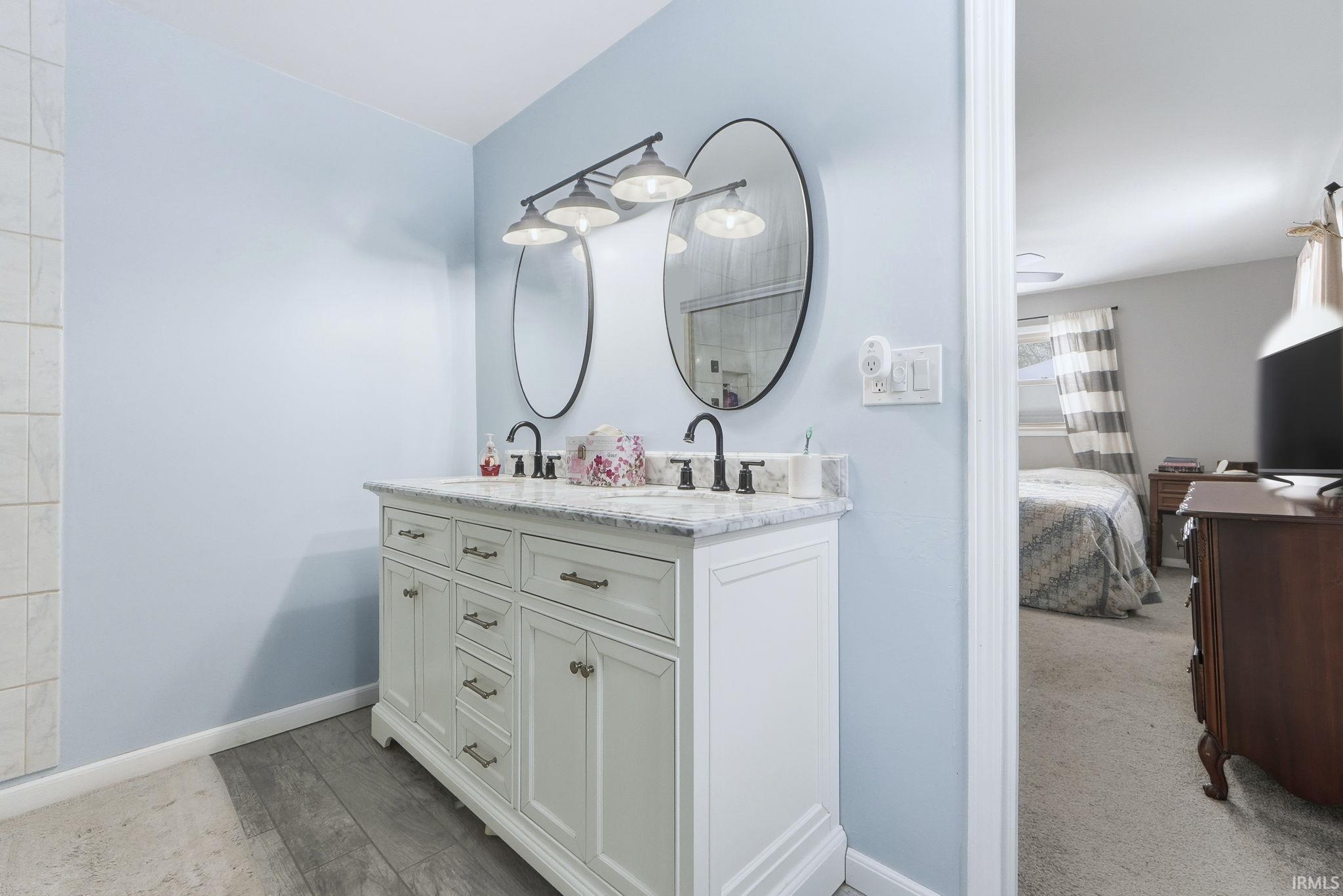 Bathroom with double vanity and ensuite bathroom