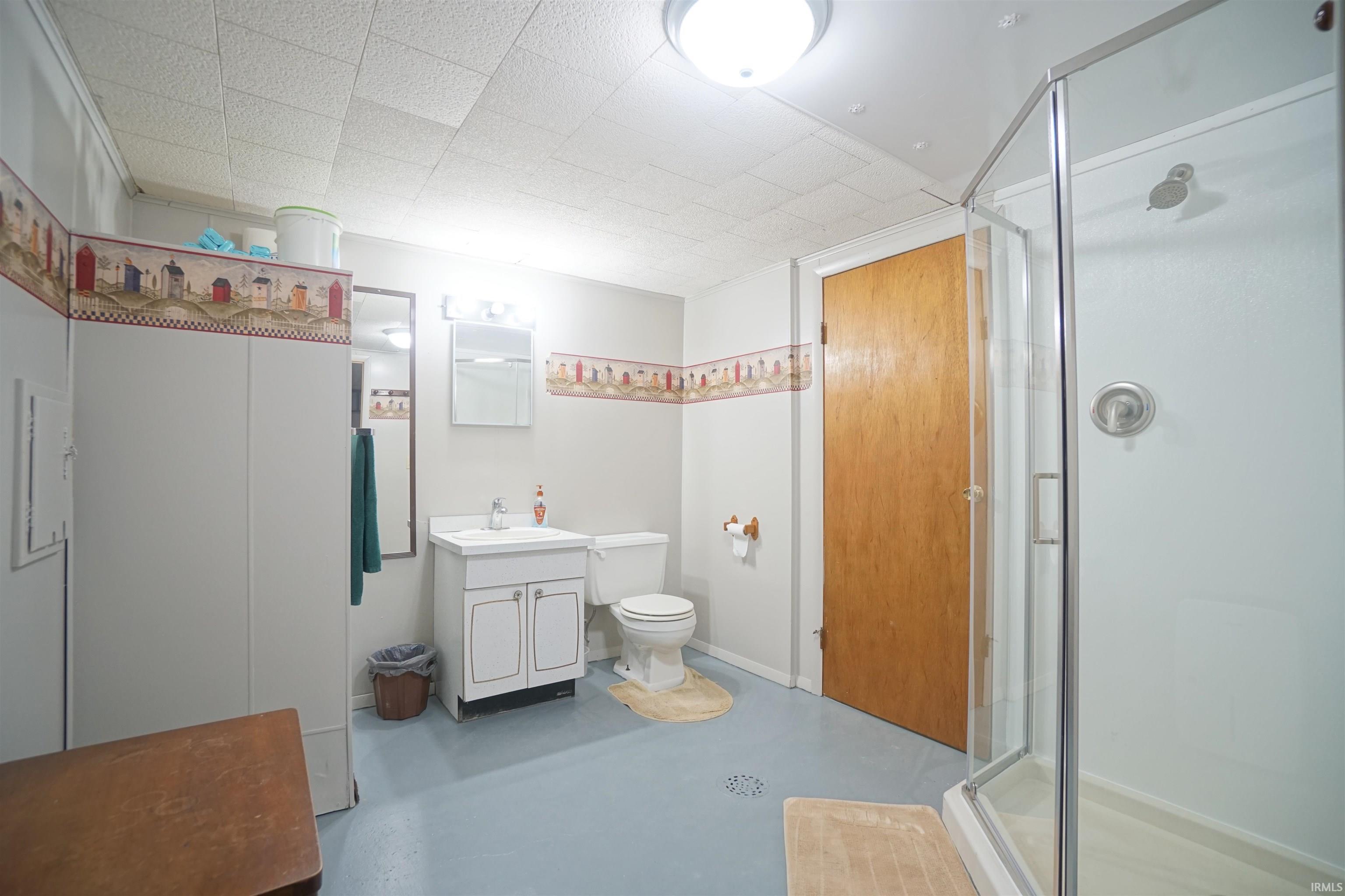 Updated full bathroom in lower level with walk-in shower, and vanity